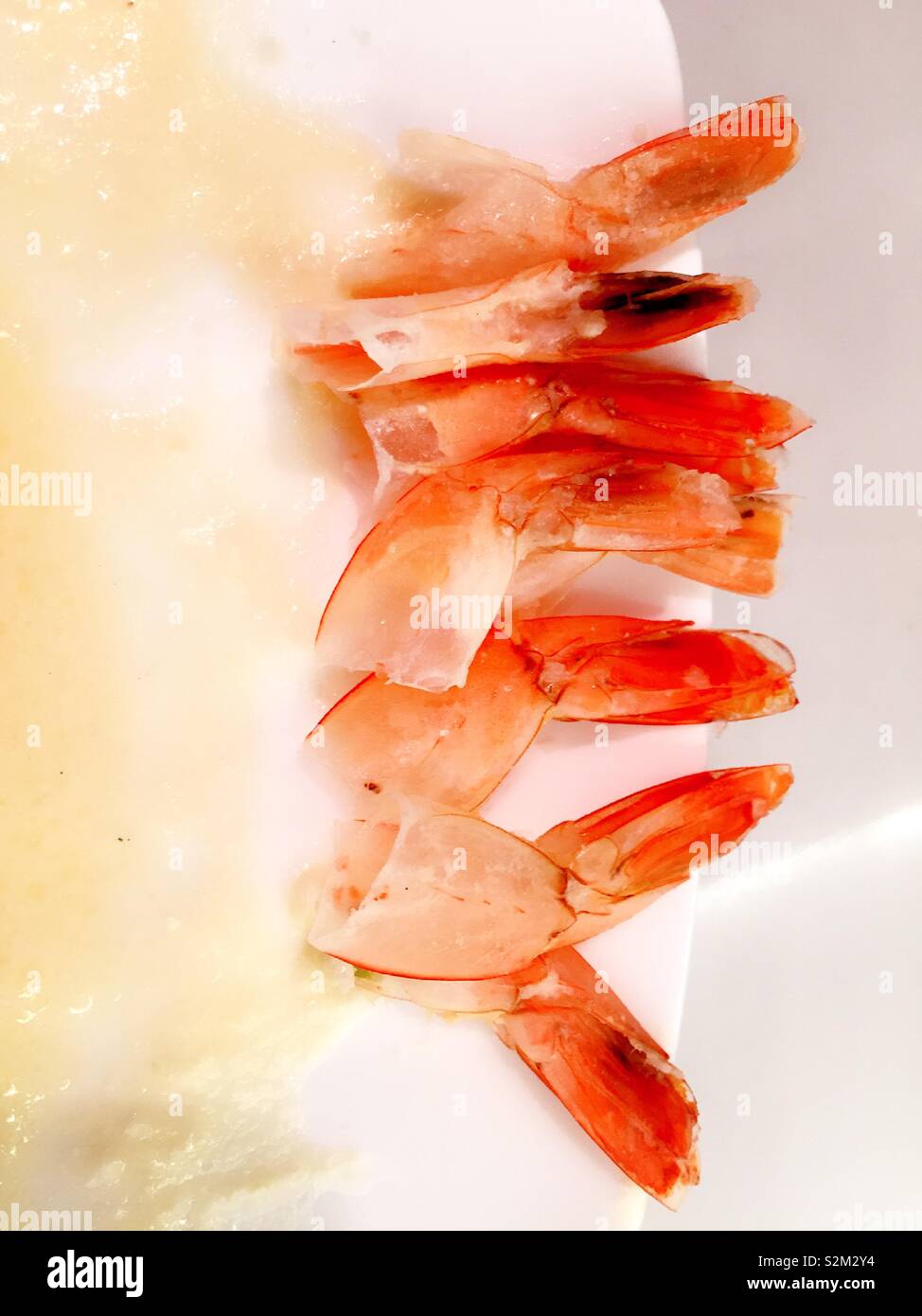 Still life, close up of shrimp tails on a china plate - Smartphone Captured Stock Image