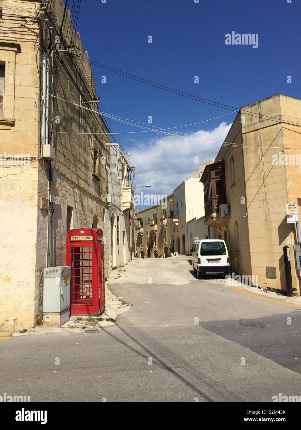 British Telephone Box in Street on Mediterranean Island of Gozo. Stock Photo
