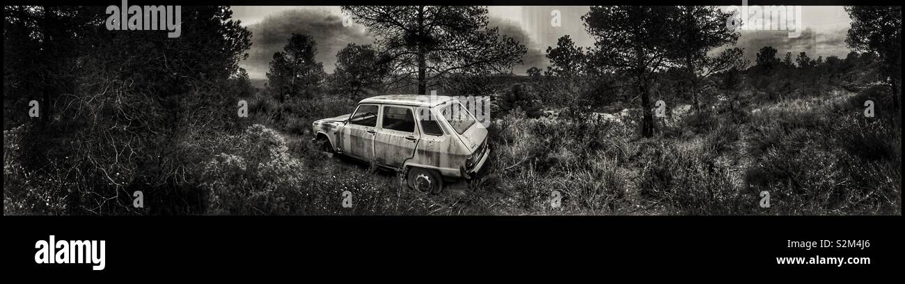 Abandoned car in the forest, Catalonia, Spain. - Smartphone Captured Stock Image
