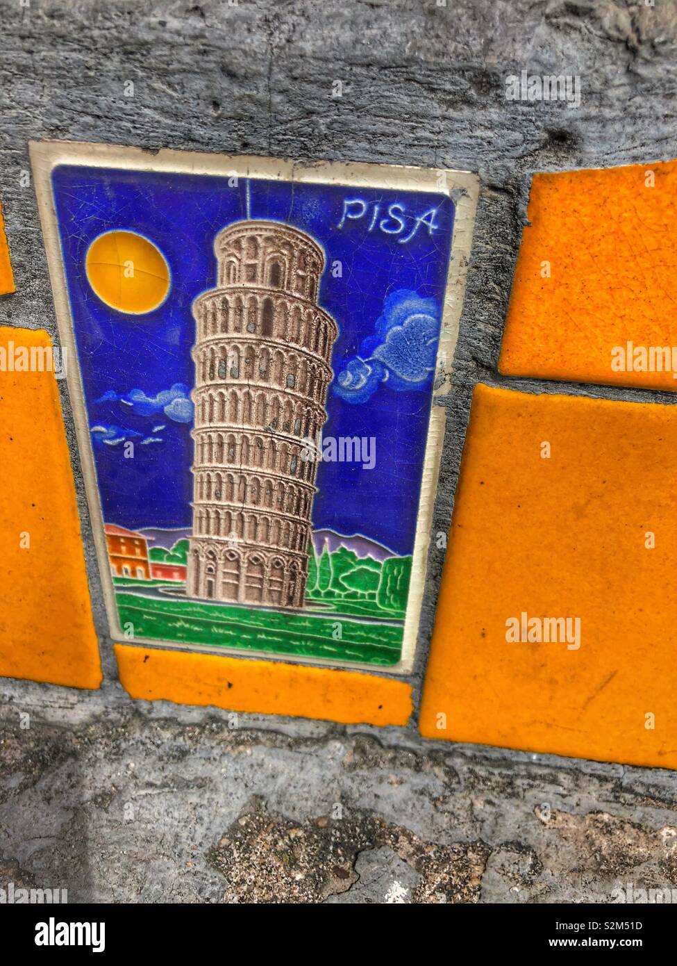 The leaning tower of Pisa painted on a ceramic tile. Stock Photo
