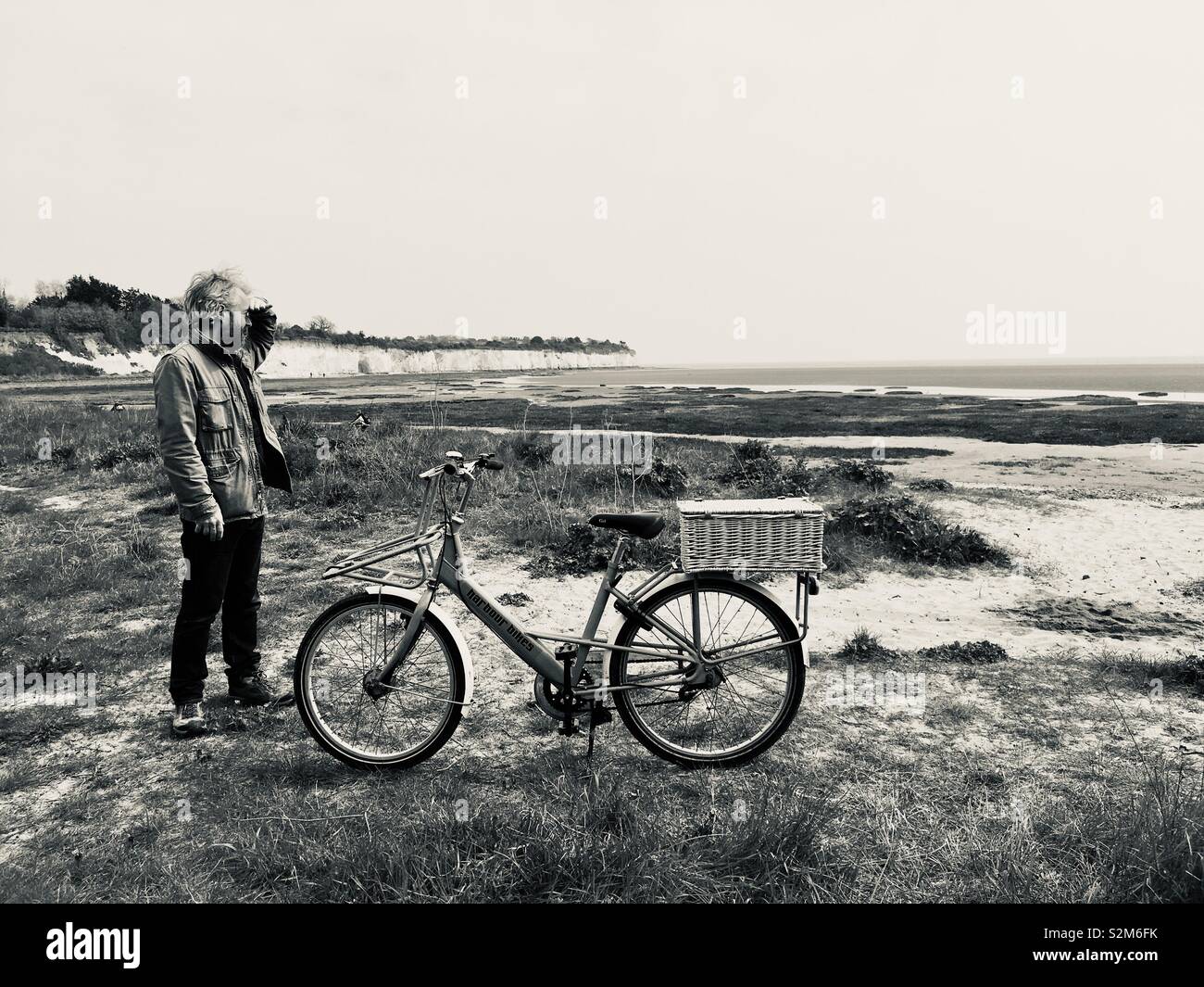 Man on beach with bike - Smartphone Captured Stock Image