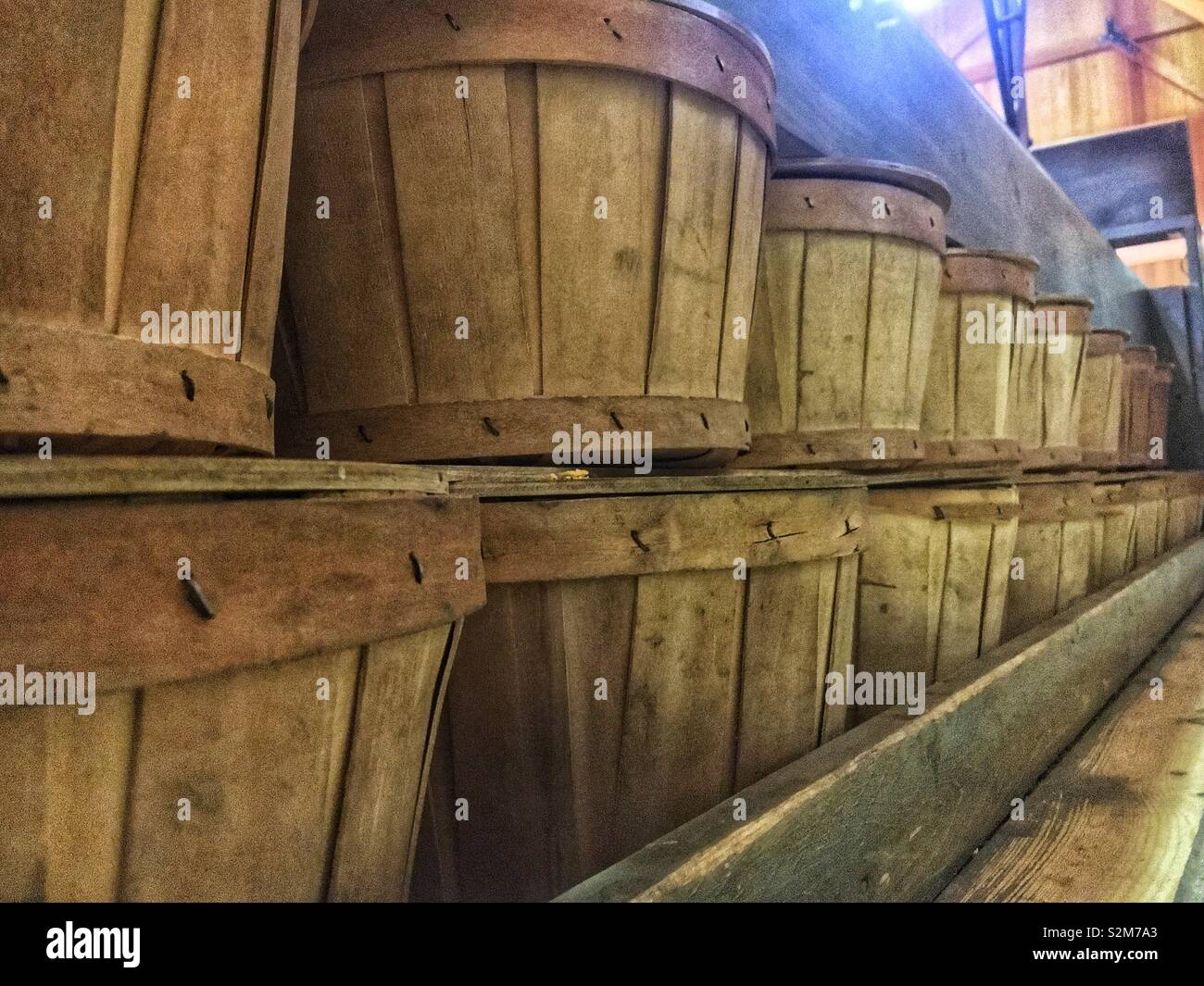 Shelves of wooden empty fresh produce boxes ready to be filled. Stock Photo