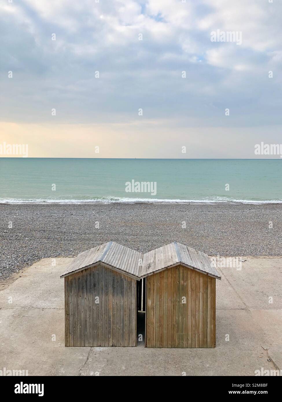 Two wooden beach huts on the waterfront in Dieppe, France, in low season. - Smartphone Captured Stock Image