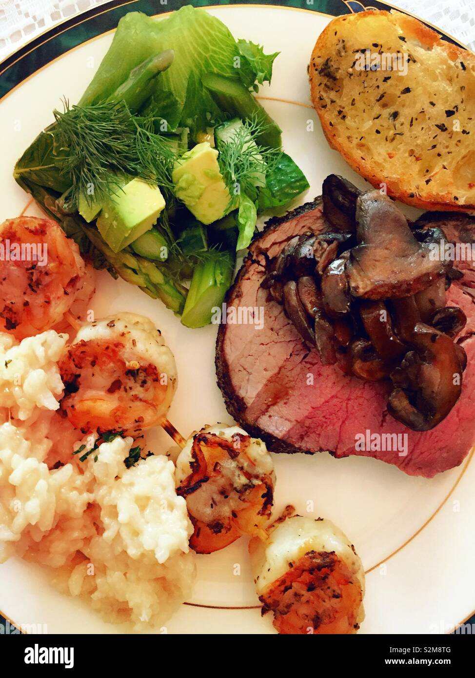 Flat lake close up of a well-balanced meal of beef tenderloin, salad, rice, USA - Smartphone Captured Stock Image