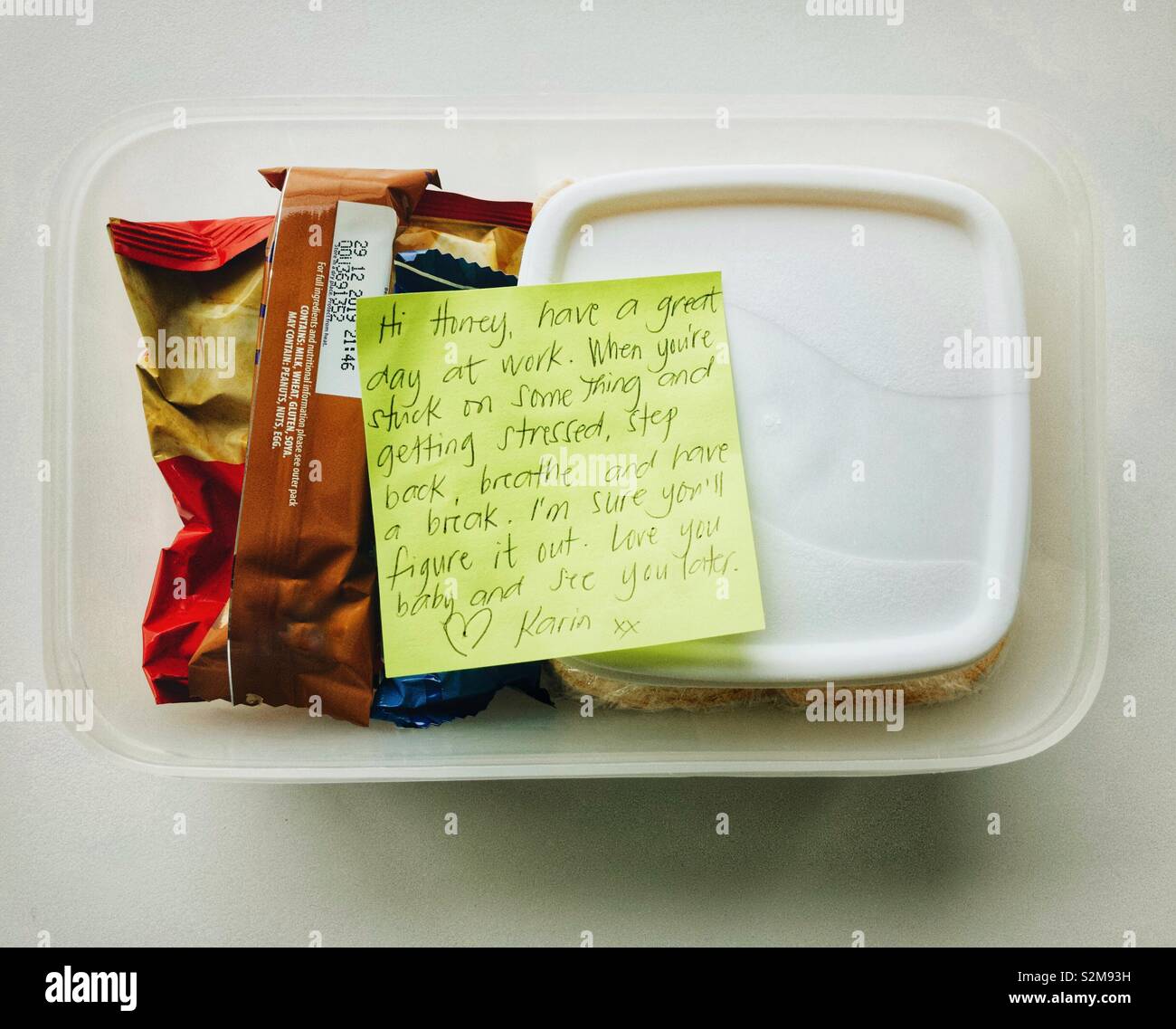 A lunch box with an inspirational love note inside. - Smartphone Captured Stock Image
