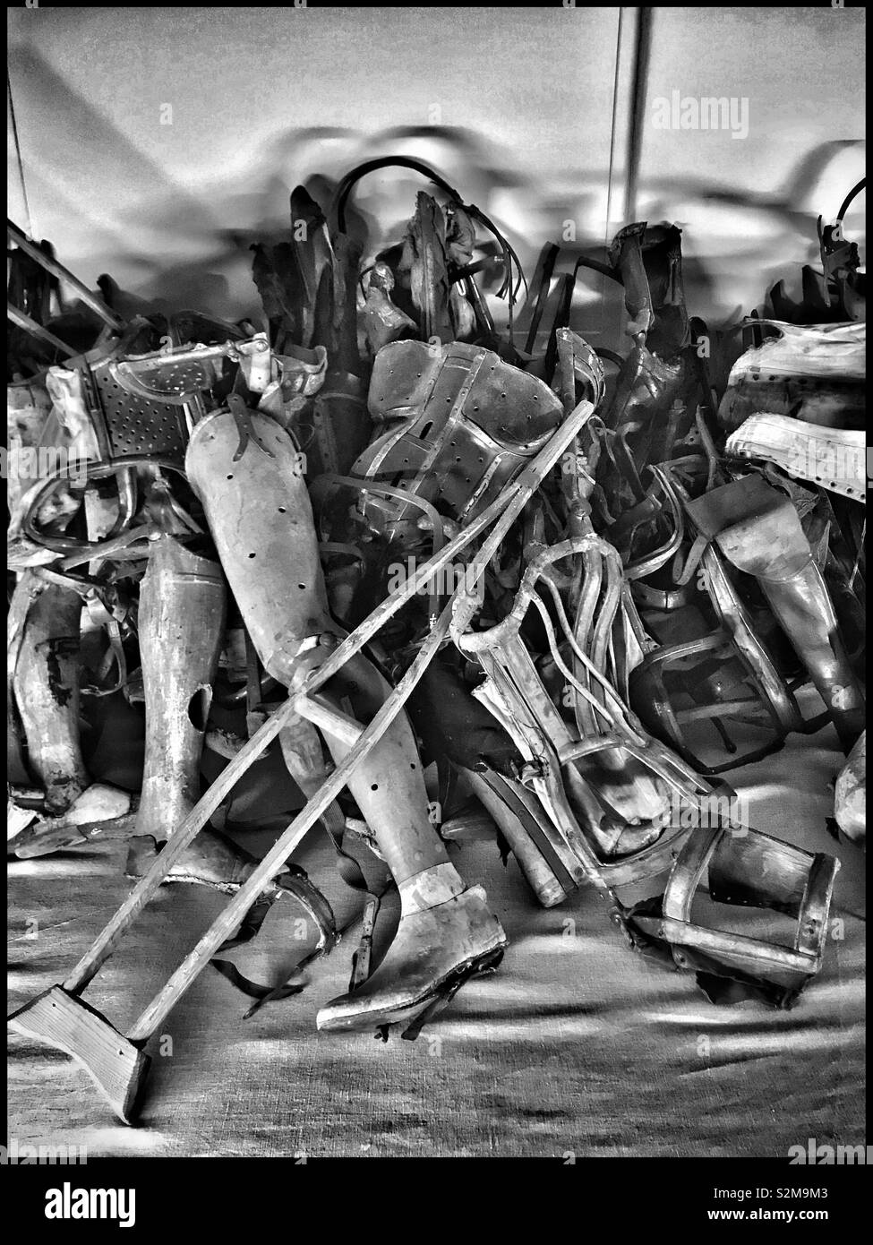A selection of confiscated walking aids - these actually belonged to the (mostly) Jewish inmates of the Nazi Auschwitz Concentration Camp. This display is now part of a UNESCO World Heritage Site. - Smartphone Captured Stock Image