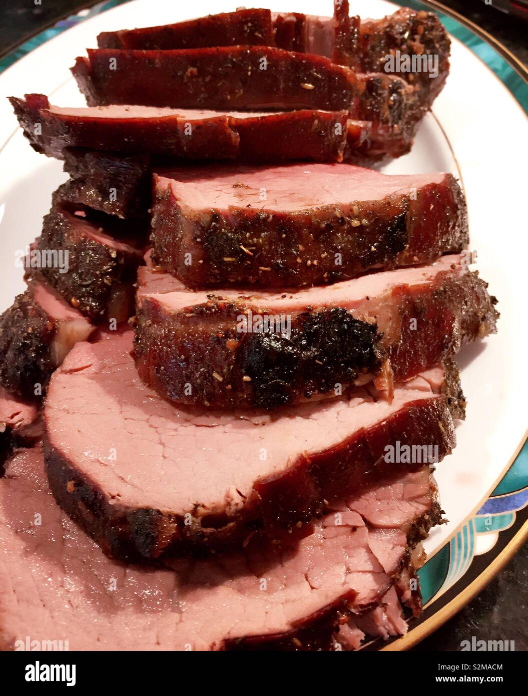Close up of a platter of a sliced beef tenderloin entrée, USA - Smartphone Captured Stock Image