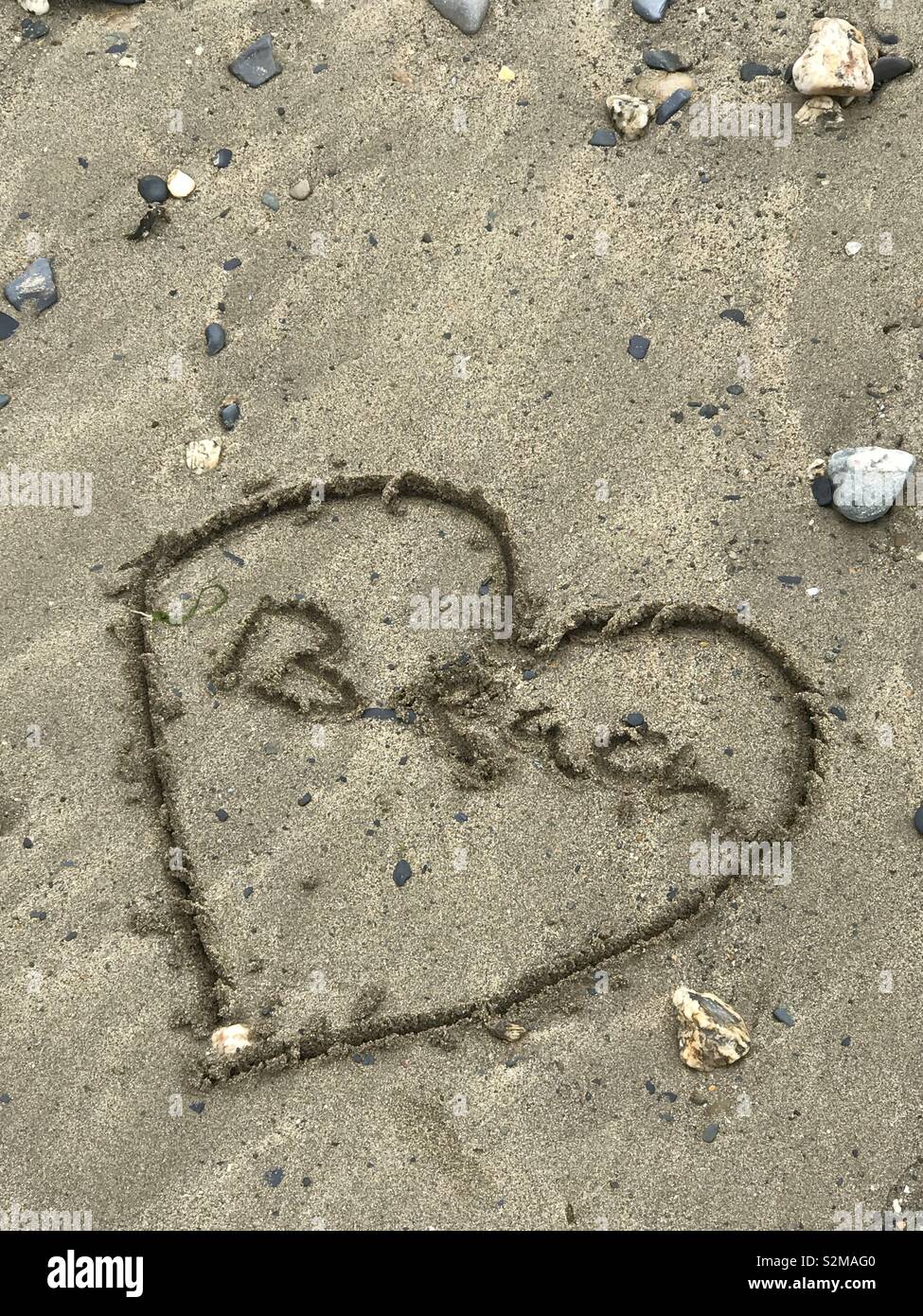 Writing in the sand on the beach Stock Photo Alamy