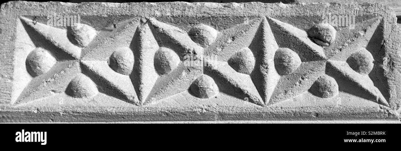 Beautiful Romanesque decorative band and pattern of salt sire crosses with raised beads between the arms. - Smartphone Captured Stock Image