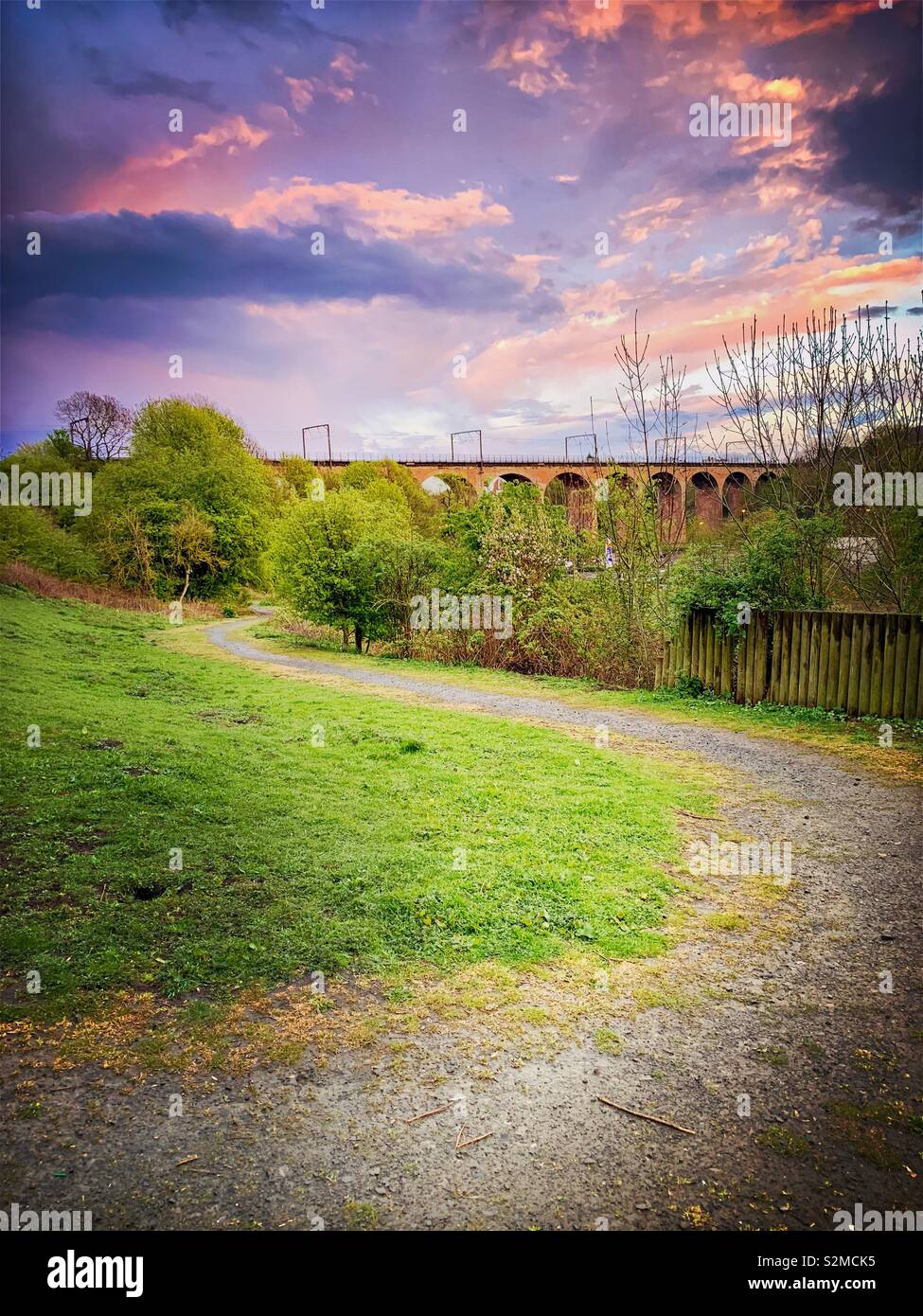 Violet colored sky during sunset over Chester Burn Railway Viaduct in Chester Le Street, County Durham, UK - Smartphone Captured Stock Image