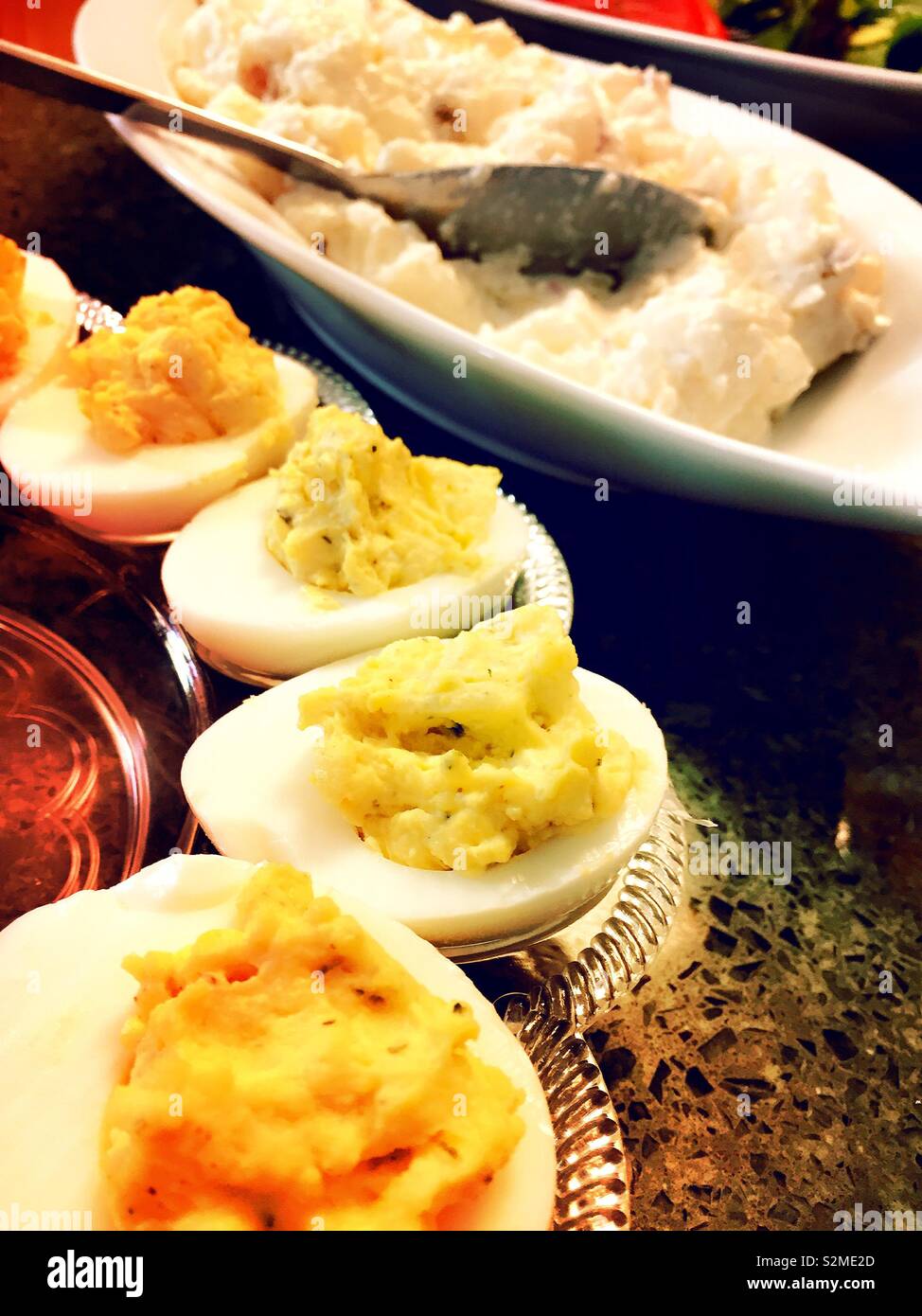 Deviled eggs and potato salad as part of a casual picnic lunch, USA - Smartphone Captured Stock Image