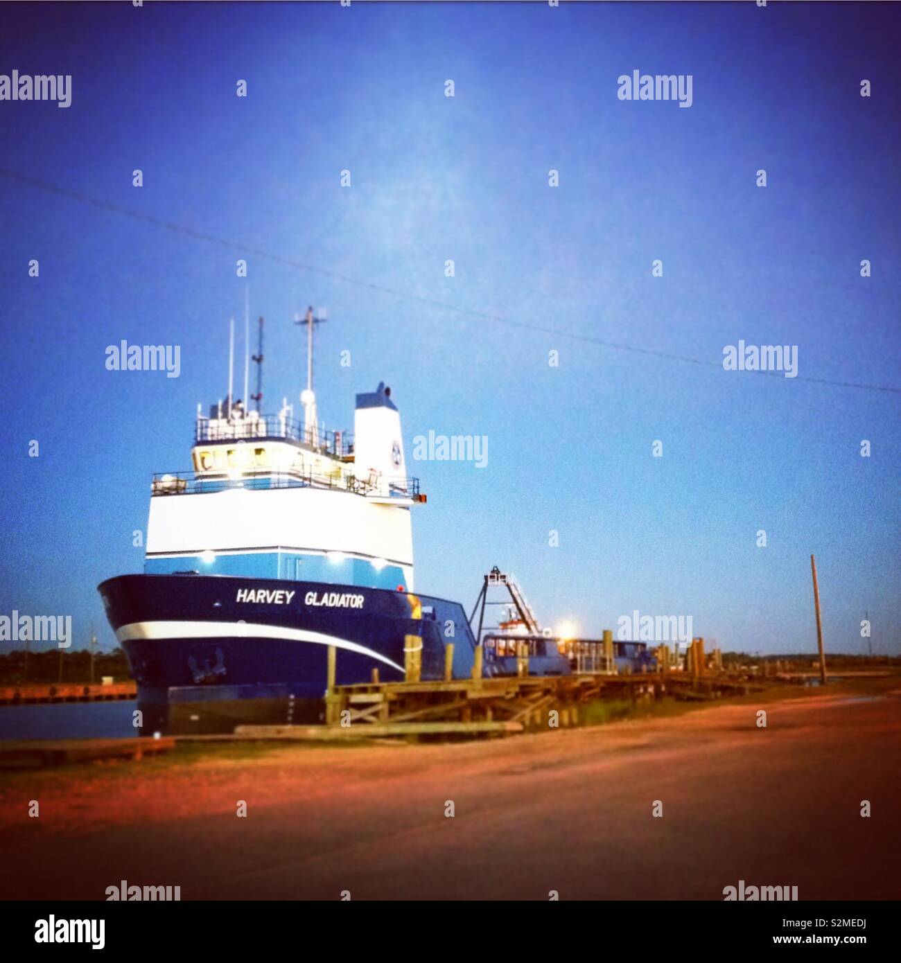 A cargo ship is docked in Bayou La Batre, Alabama. Stock Photo