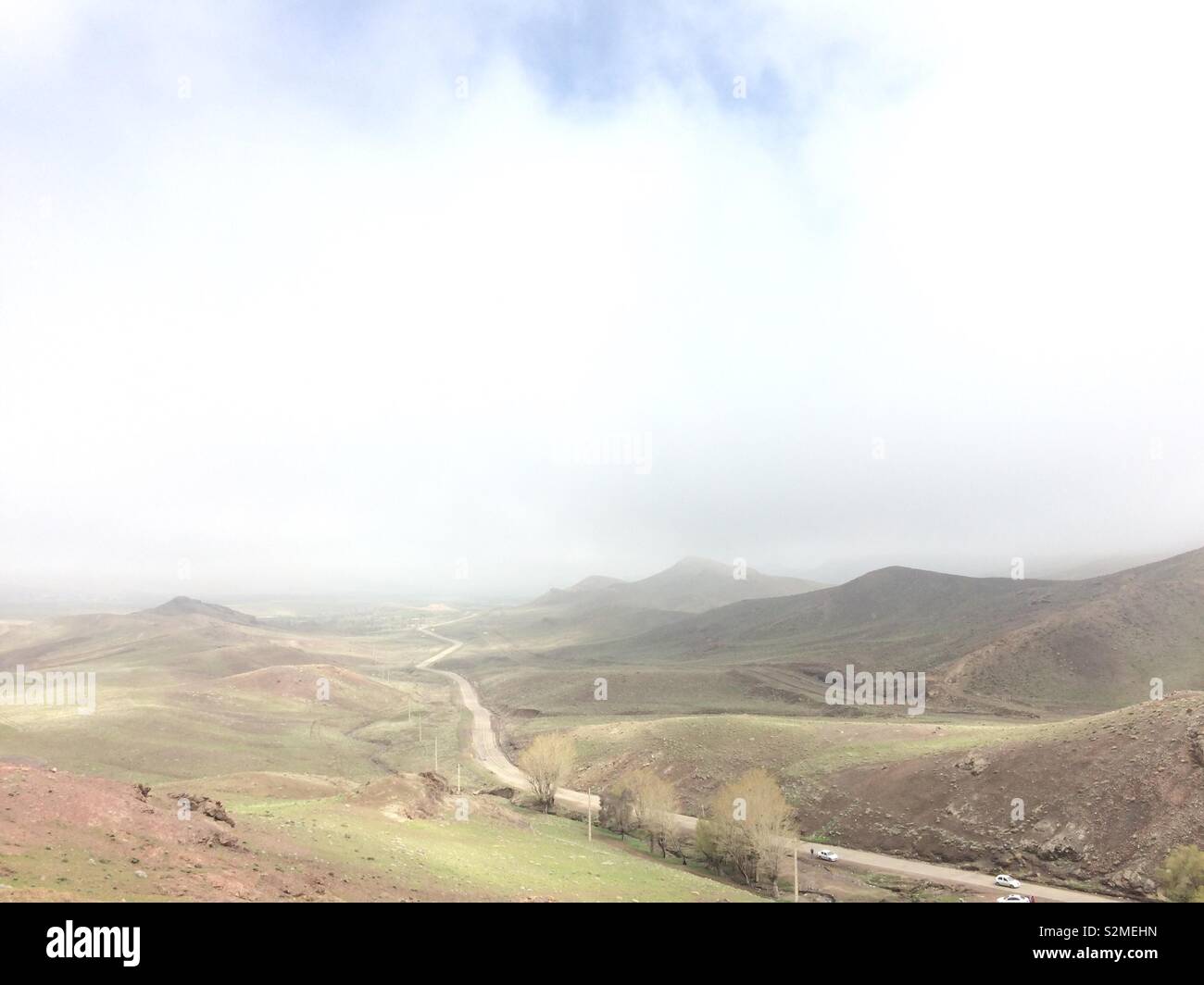 Road among hills landscape, Kashan Iran Stock Photo