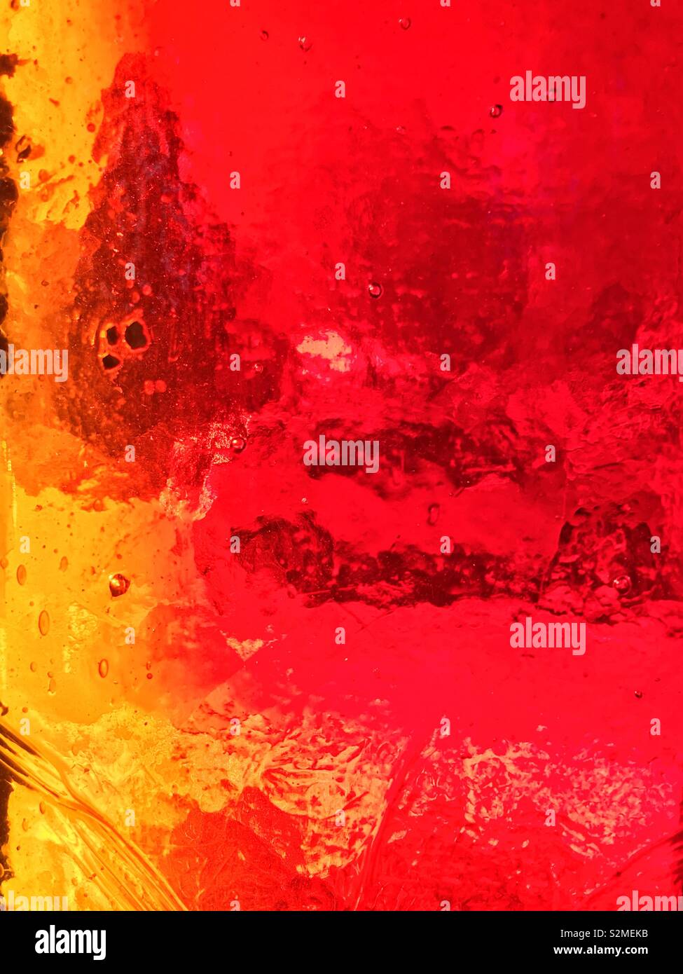 Decorative brightly colored stained textured translucent glass with a random abstract pattern. - Smartphone Captured Stock Image