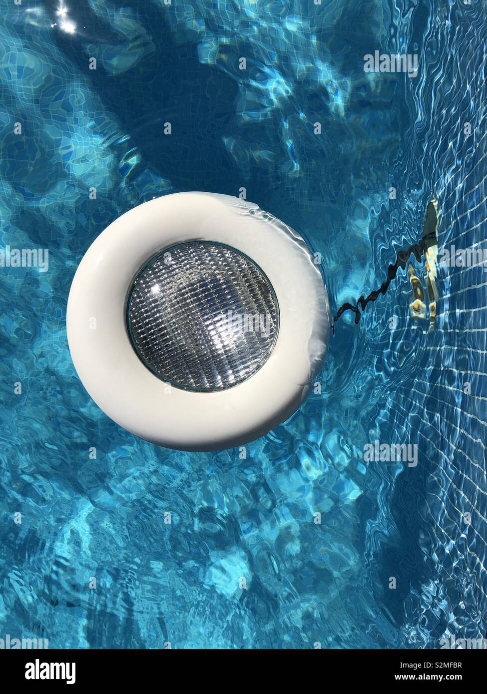 Broken pool light floating Stock Photo Alamy