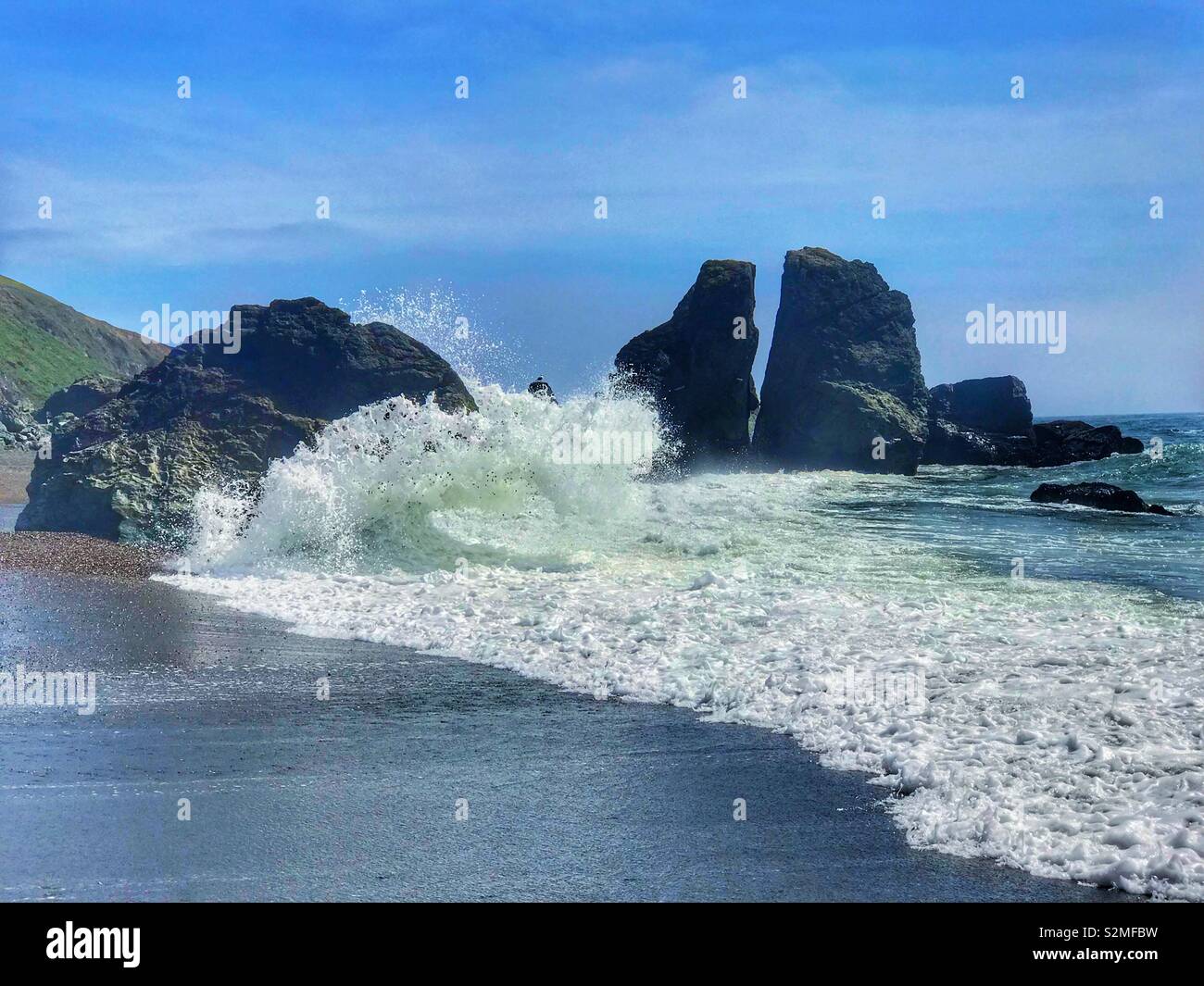 Curling waves hitting the shore - Smartphone Captured Stock Image