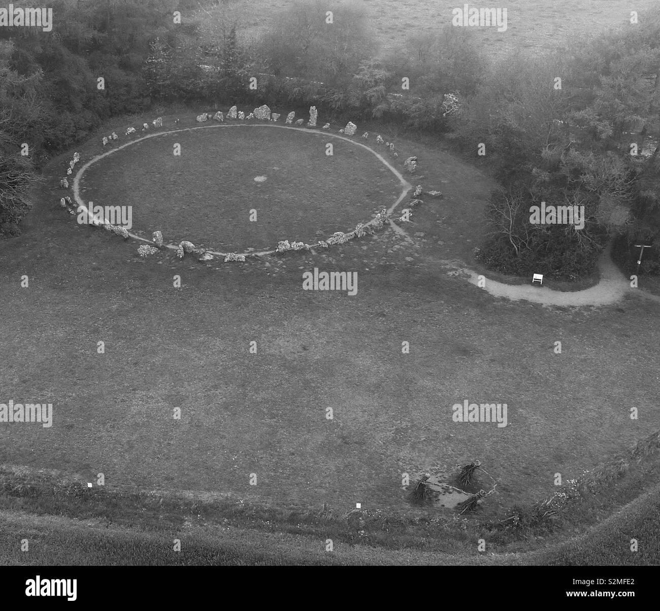The Rollright stones and prehistoric stone circle, Oxfordshire with woven sculpture of the Dancers (or Witches) in foreground. - Smartphone Captured Stock Image
