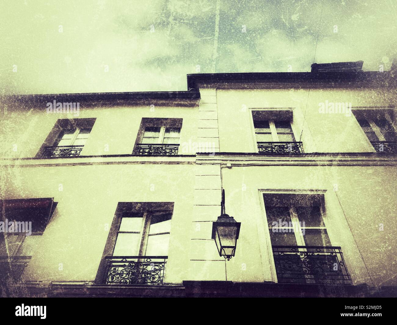 Old architecture building with vintage street bulb in Montmartre, Paris France - Smartphone Captured Stock Image