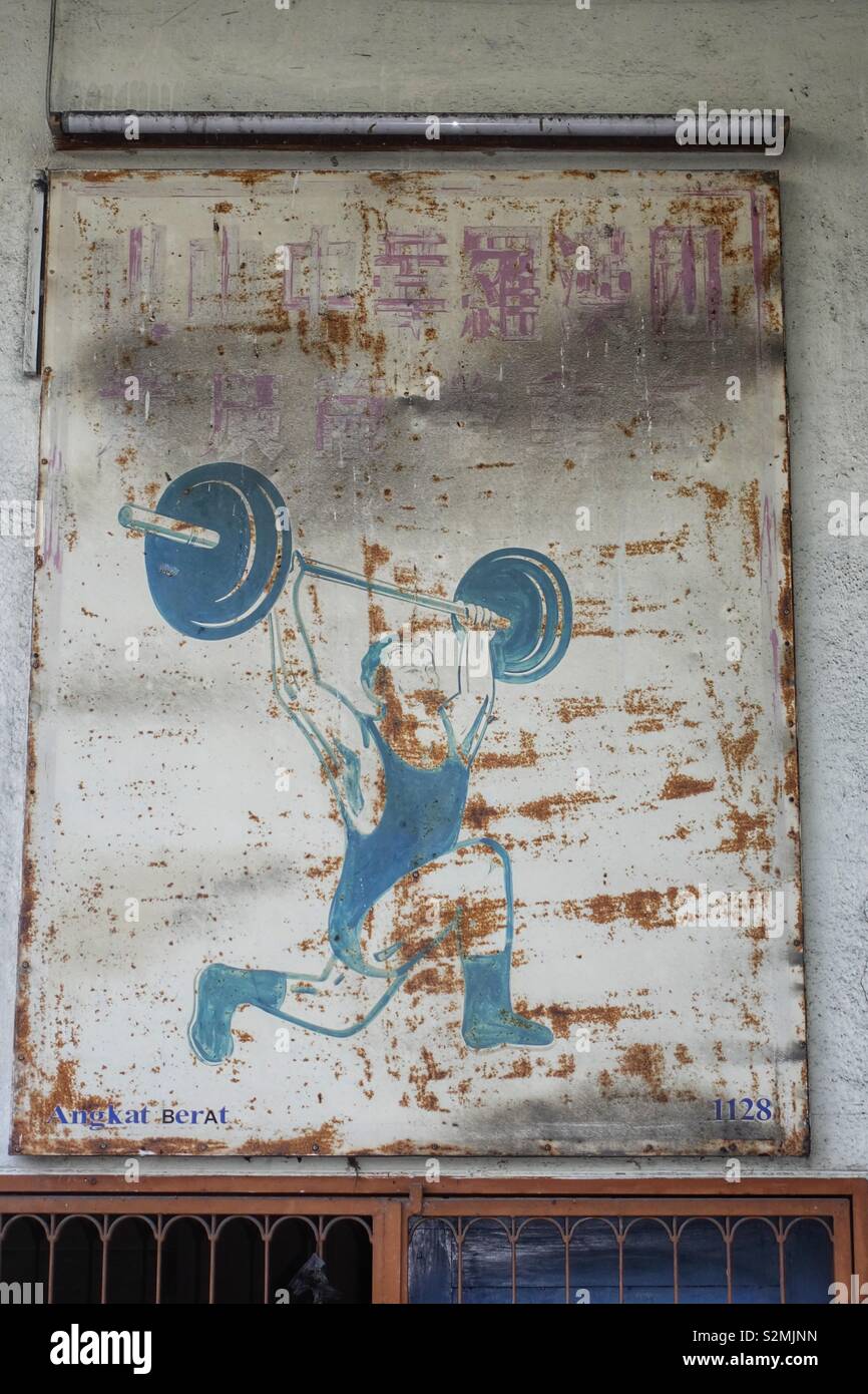 Vintage picture of a weightlifter on a rusty metal plate Stock Photo