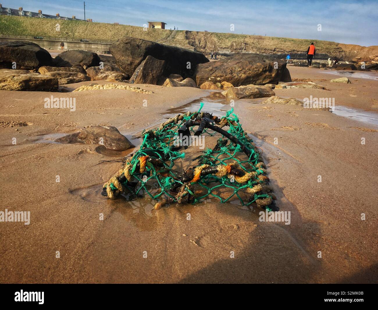Crab pot on a beach Stock Photo