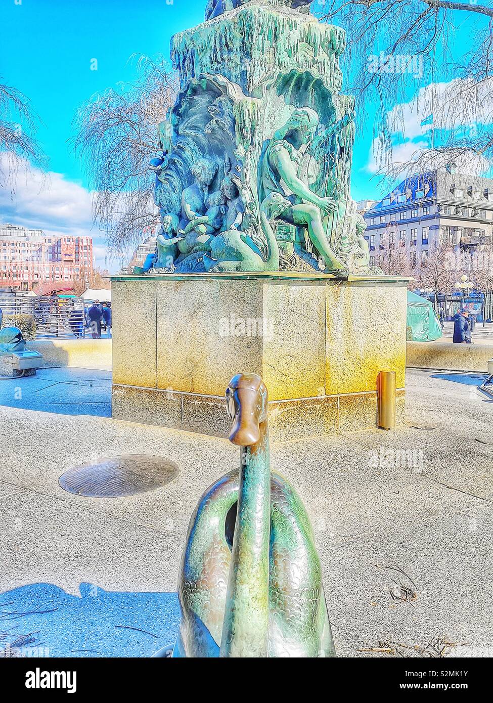Bronze fountain 1873 by Swedish sculptor Johan Peter Molin. Characters are Ocean god Aegir, wife Ran and 9 daughters listening to the river spirit Nix playing his harp. Kungstradgarden,  Stockholm - Smartphone Captured Stock Image