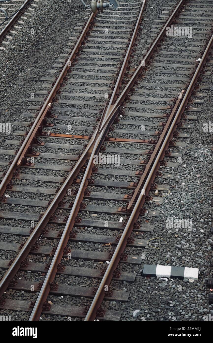 old train tracks in the station in the street Stock Photo
