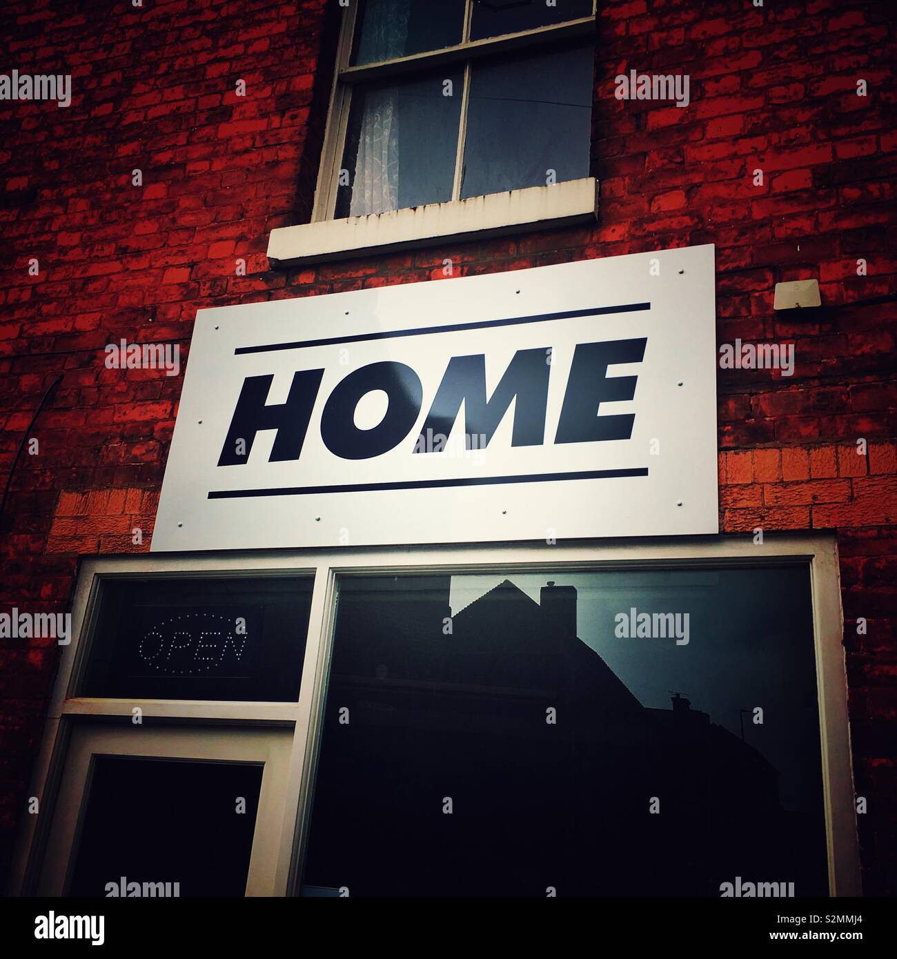 Home announcement on outside wall - Smartphone Captured Stock Image