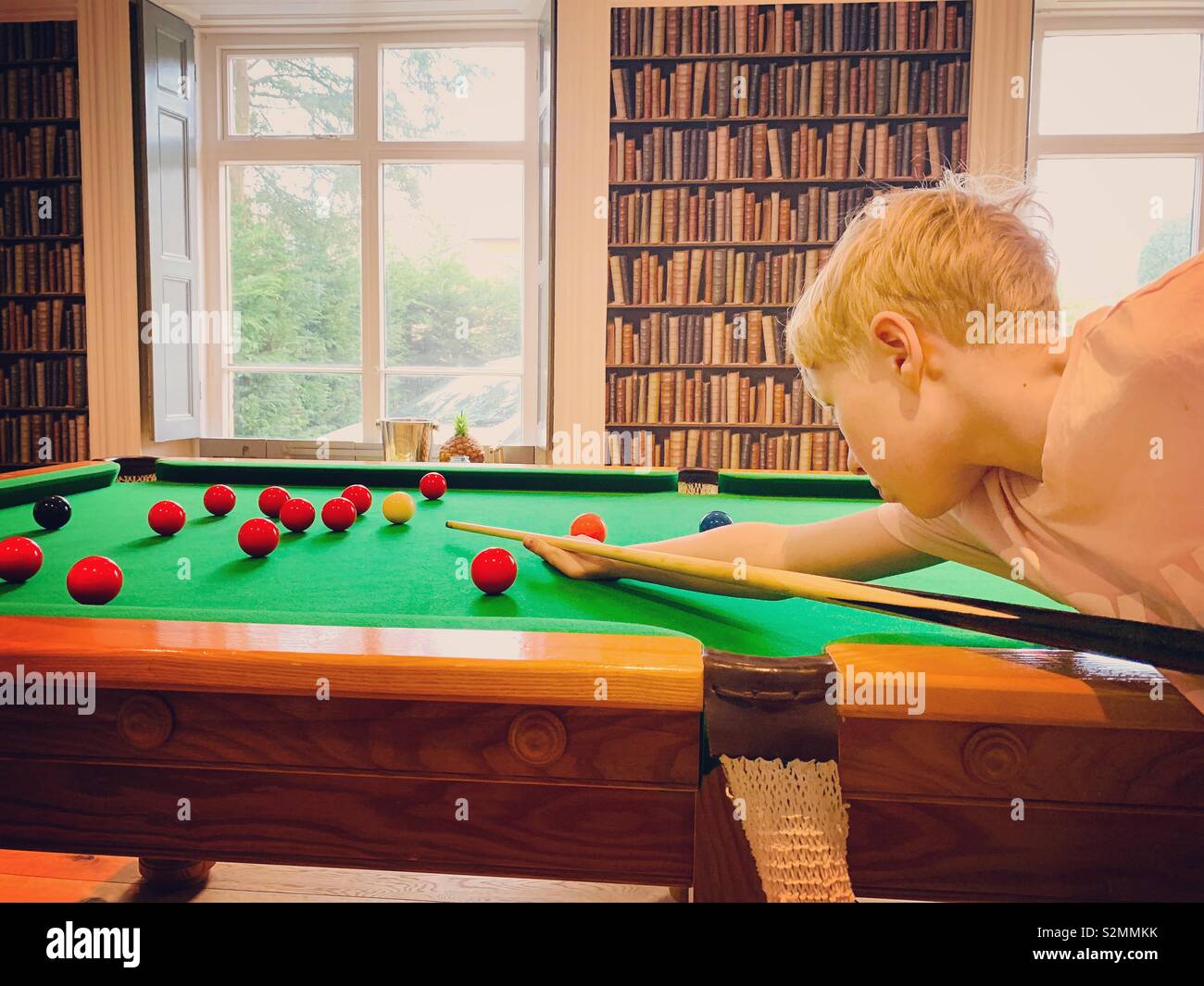 Boy playing snooker Stock Photo