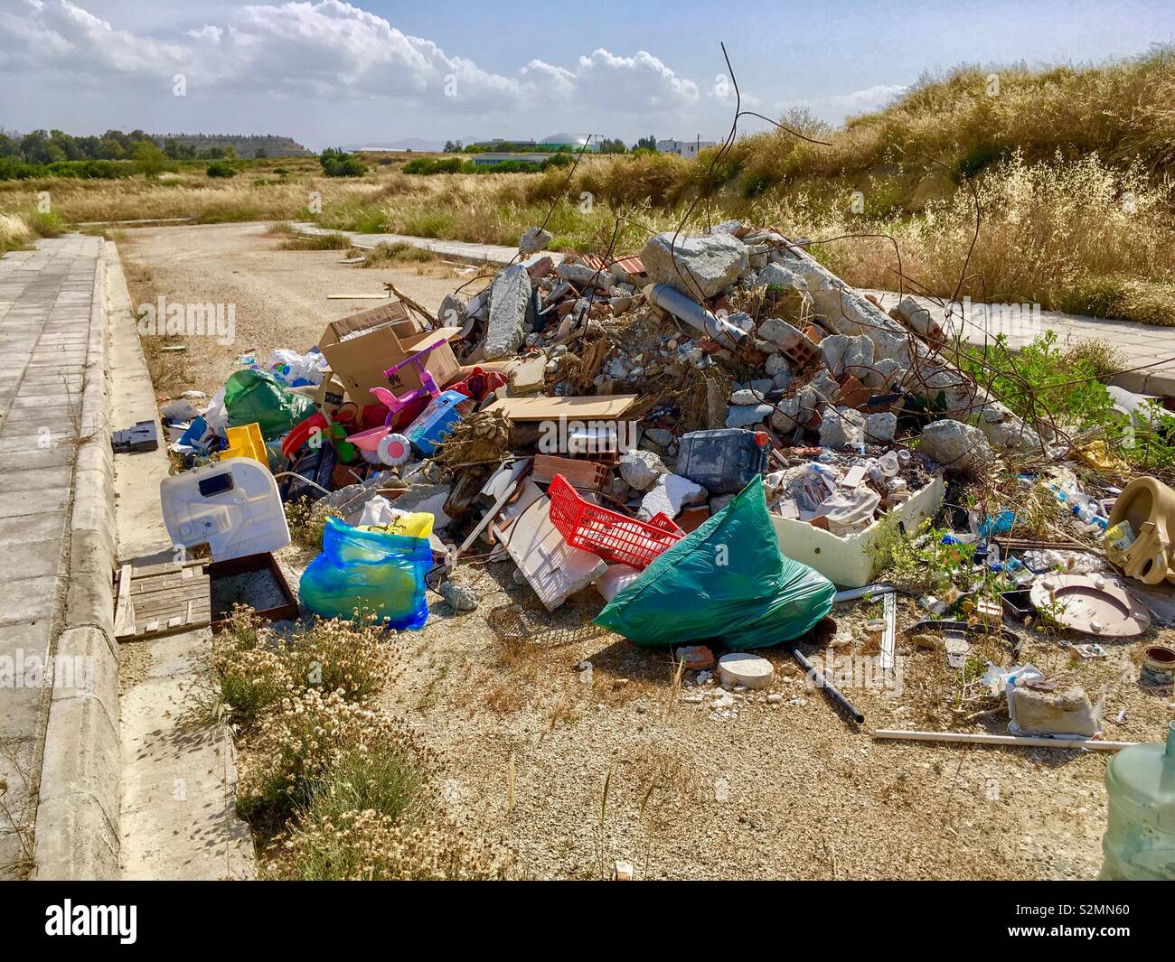 Flytipping on metalled road Stock Photo
