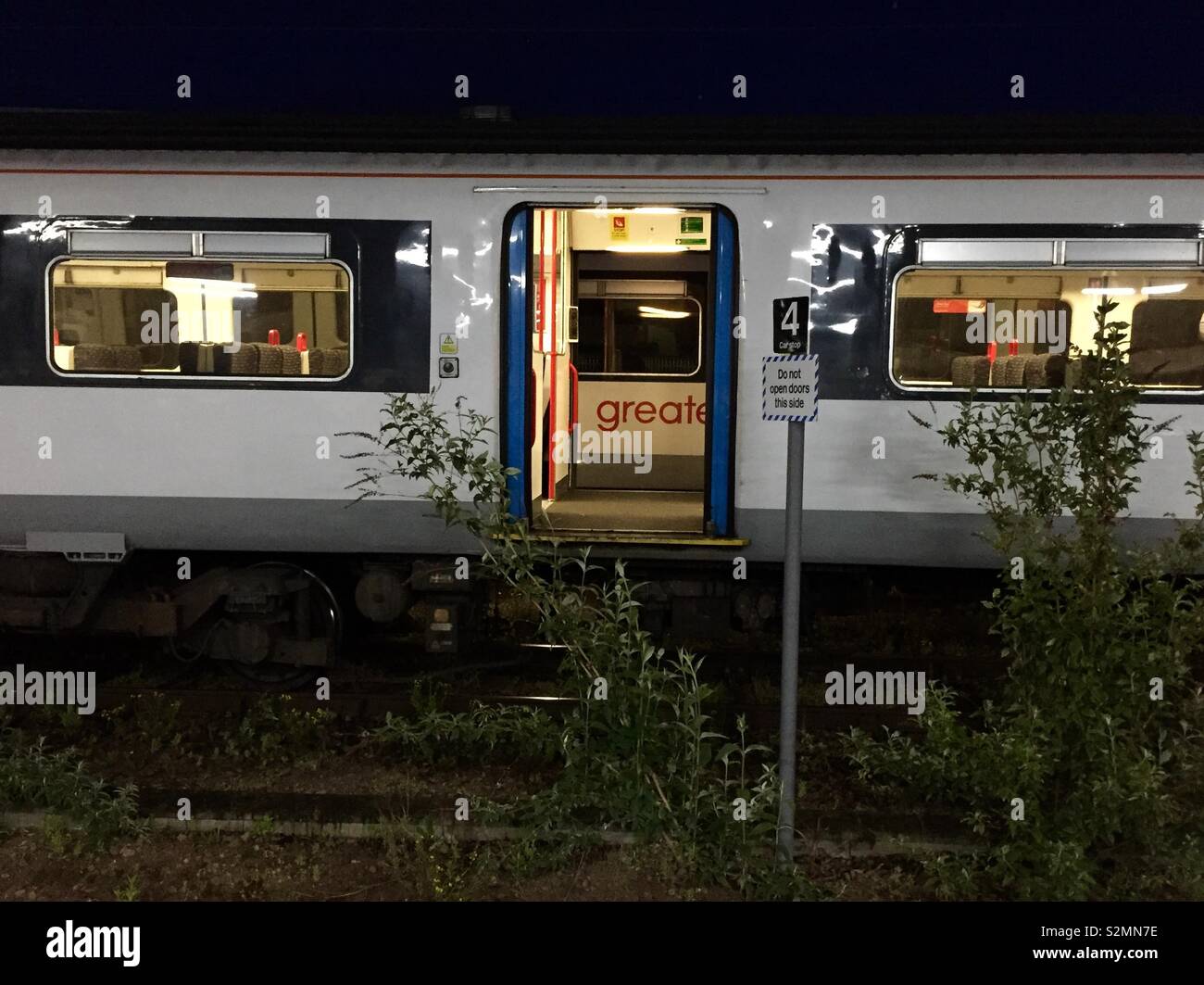 Do not open doors on this side - Smartphone Captured Stock Image