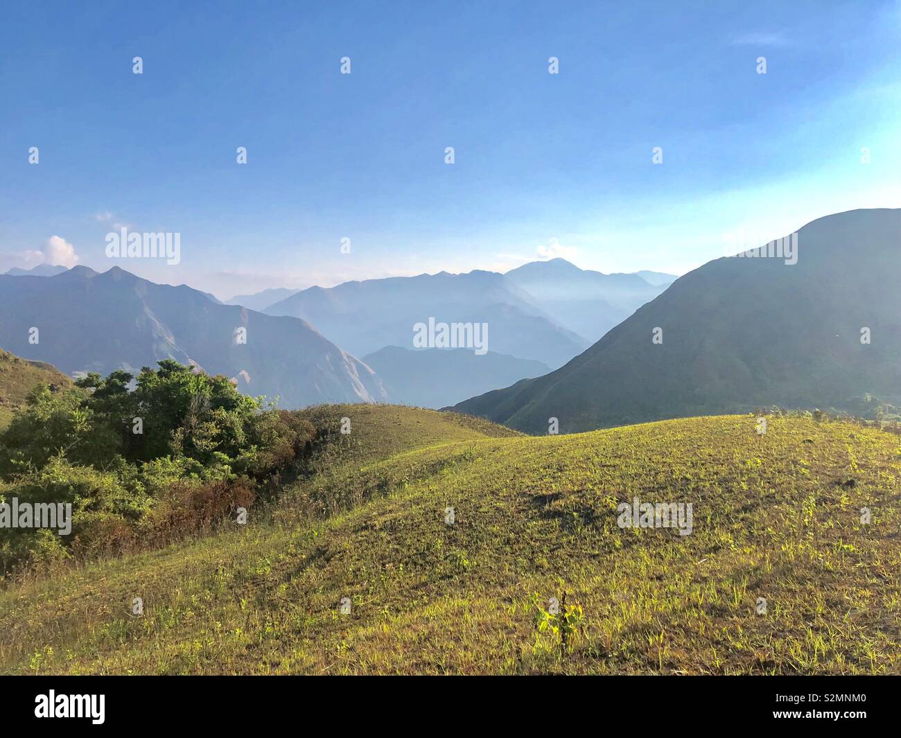 The Magawang mountain range is a habitat for the endangered Tamaraw and favorite hiking destination for mountaineers. - Smartphone Captured Stock Image