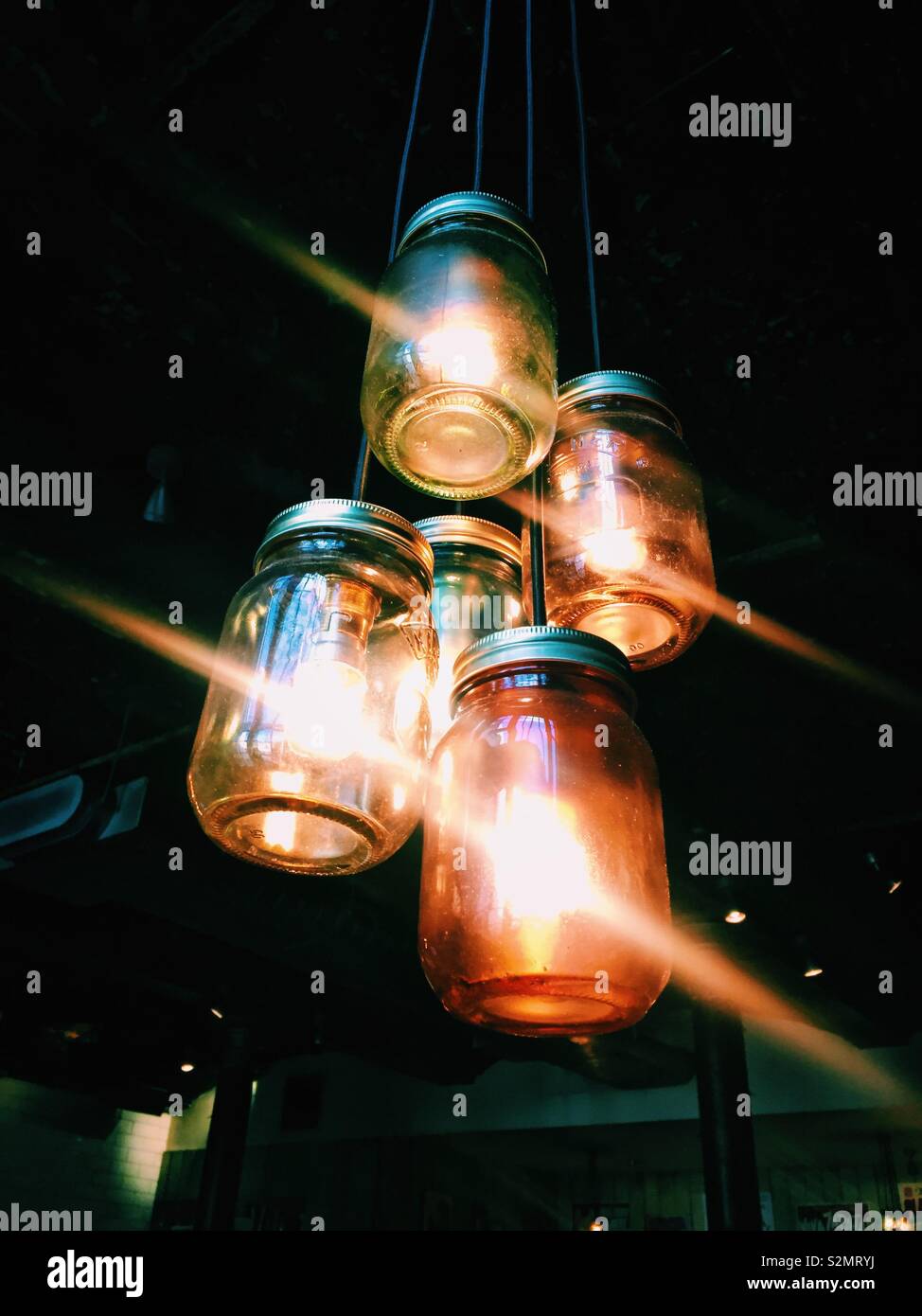 Colourful hanging jam jar lights Stock Photo Alamy