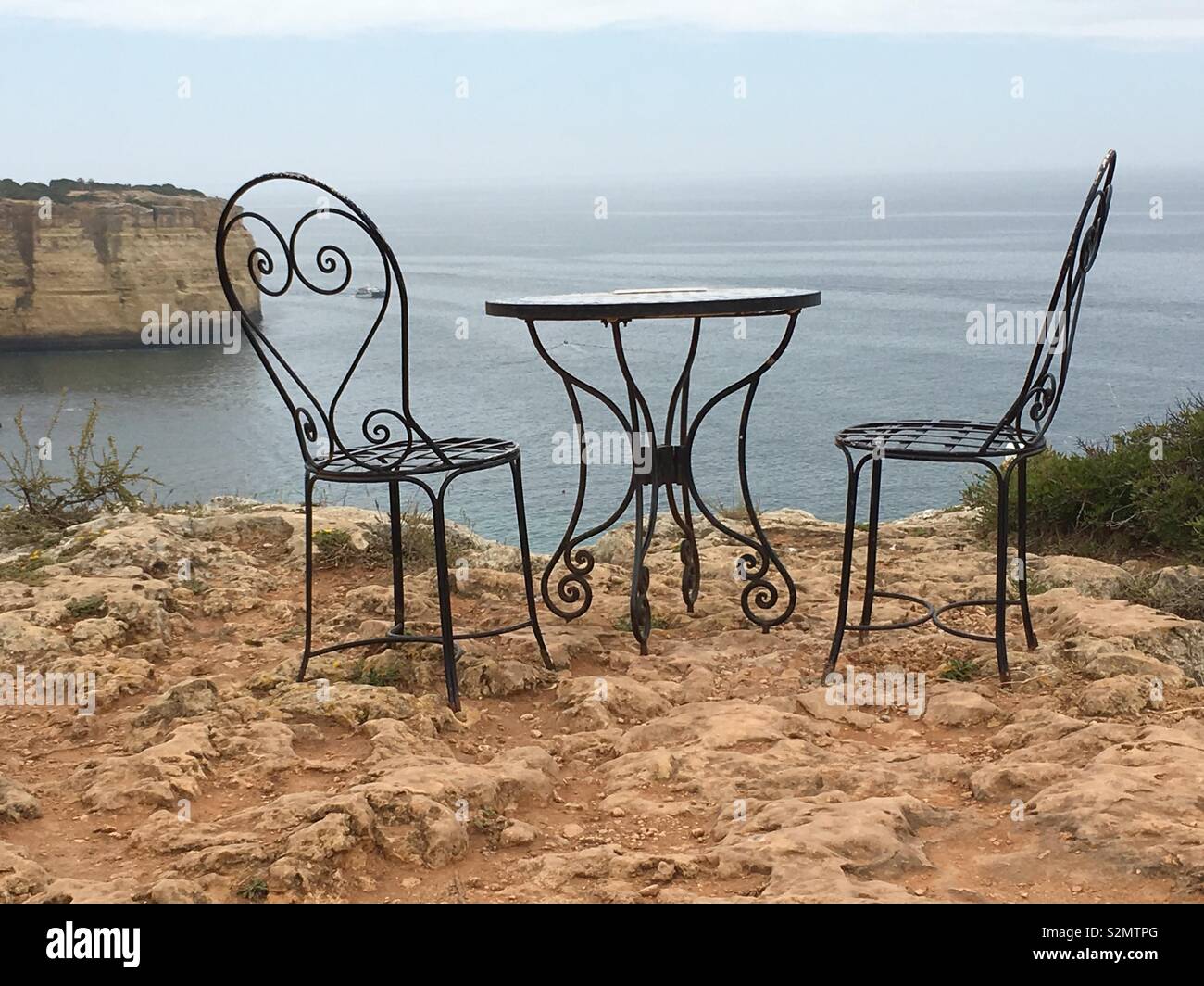 Symbolic rest place above cliffs of Algarve coastline, Portugal. Stock Photo