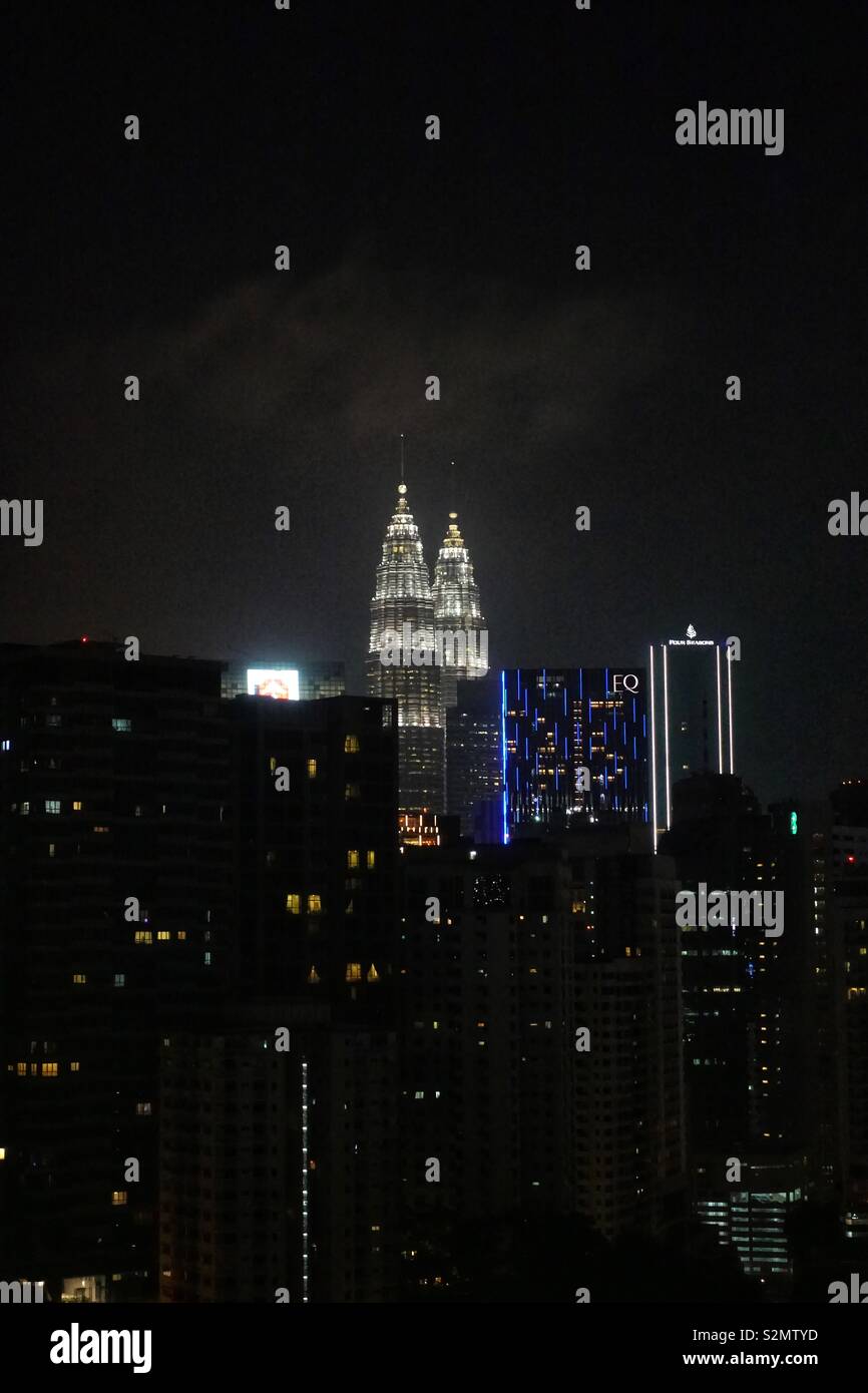Kuala Lumpur by night. Apartment buildings and some skyscrapers. Stock Photo