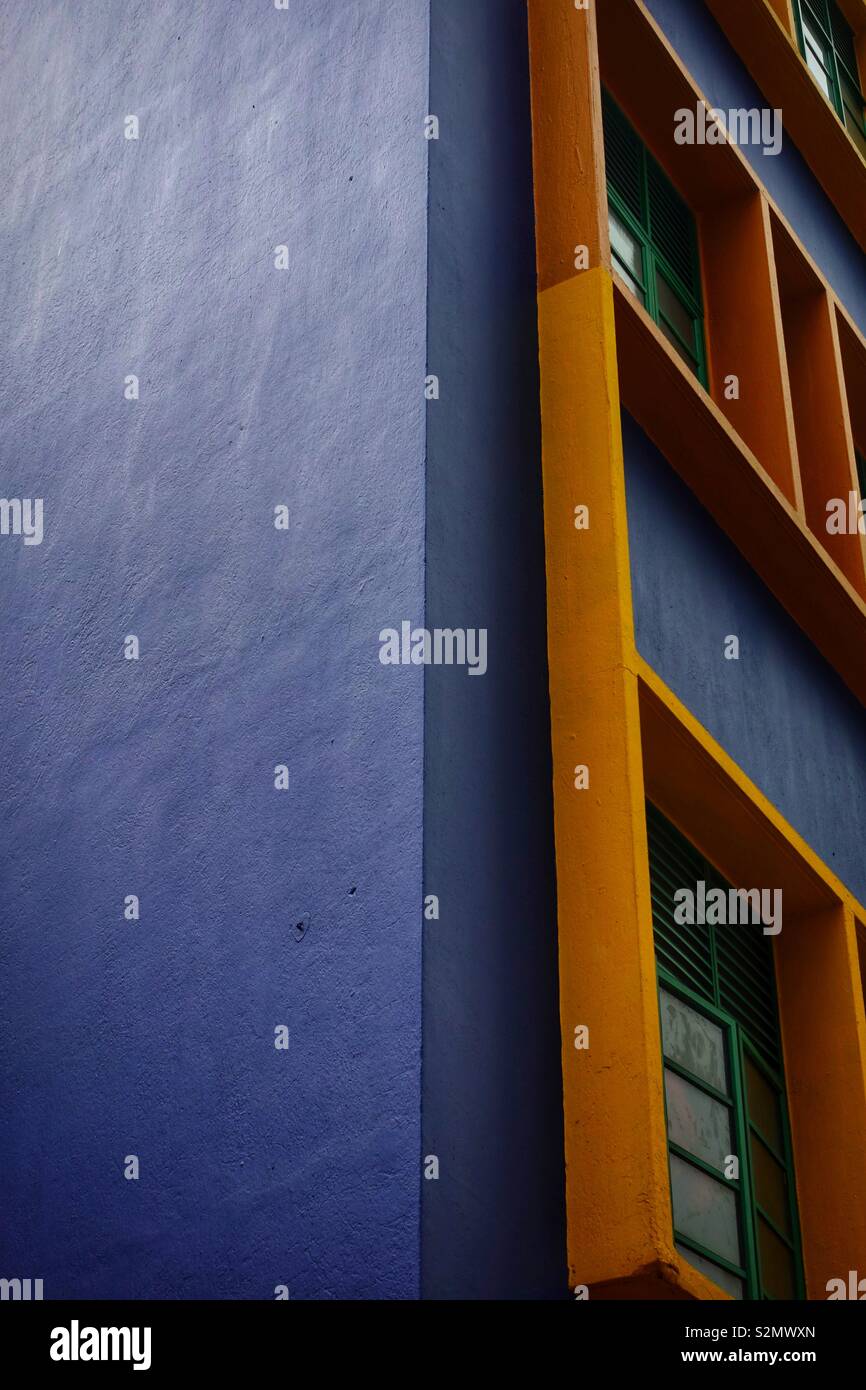 Blue and orange facade if an apartment building in singapore. Beautiful multicolored architecture. Stock Photo