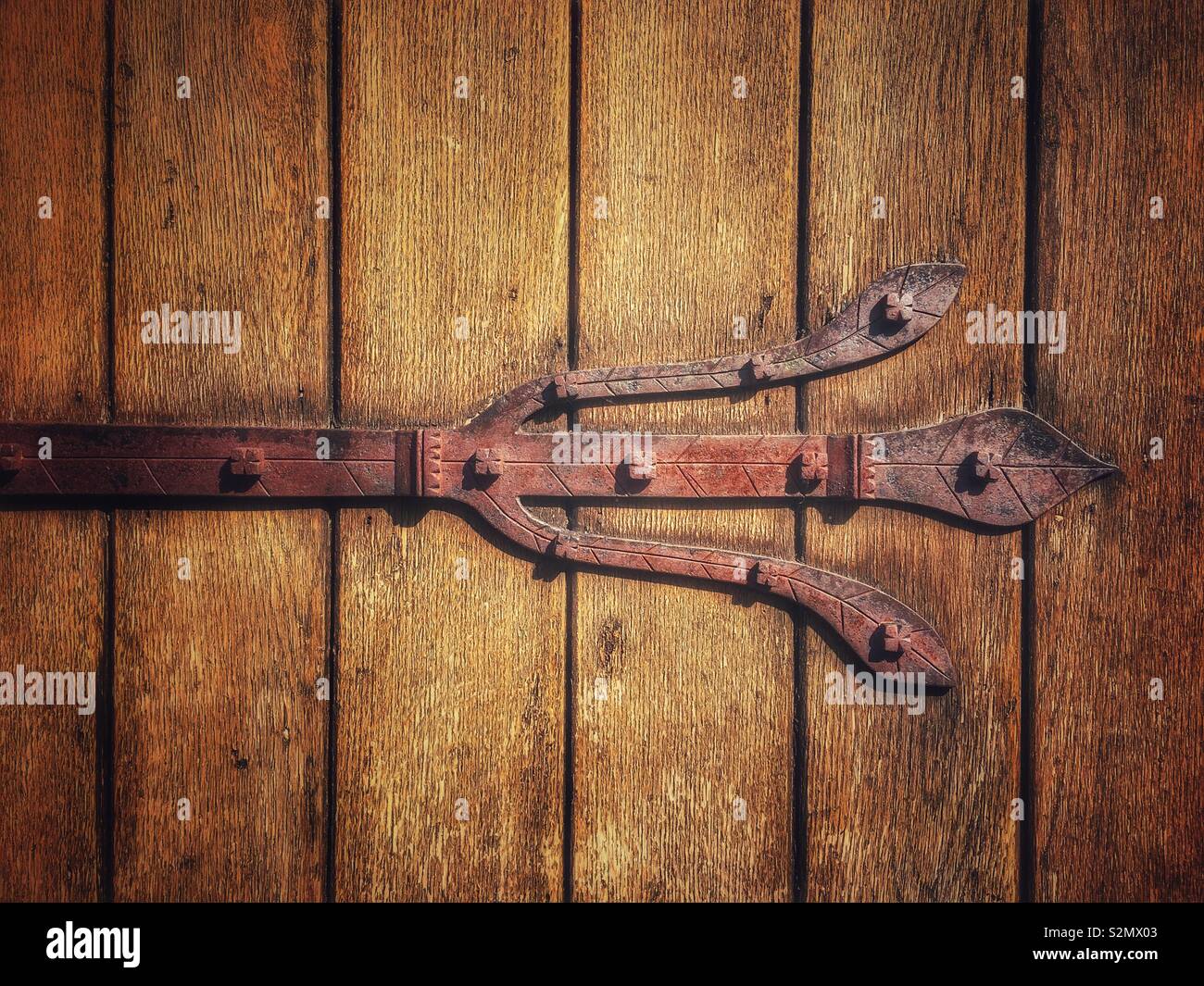 Decorative hinge on church door - Smartphone Captured Stock Image