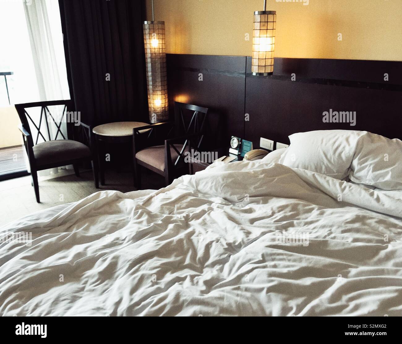 Unmade bed in a fancy hotel in Manila, Philippines Stock Photo