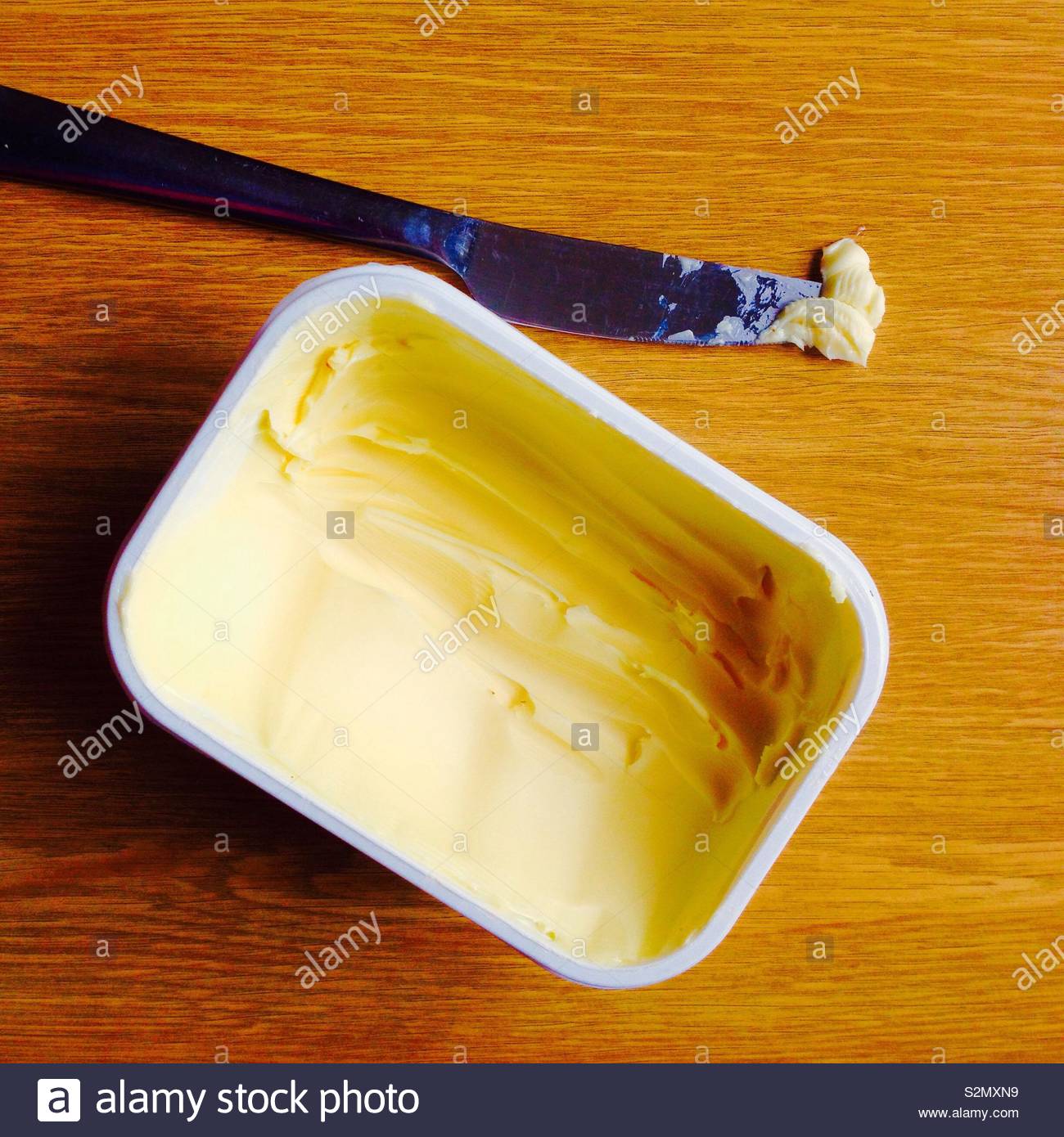 Download Tub Of Butter And Knife From Above Stock Photo Alamy PSD Mockup Templates