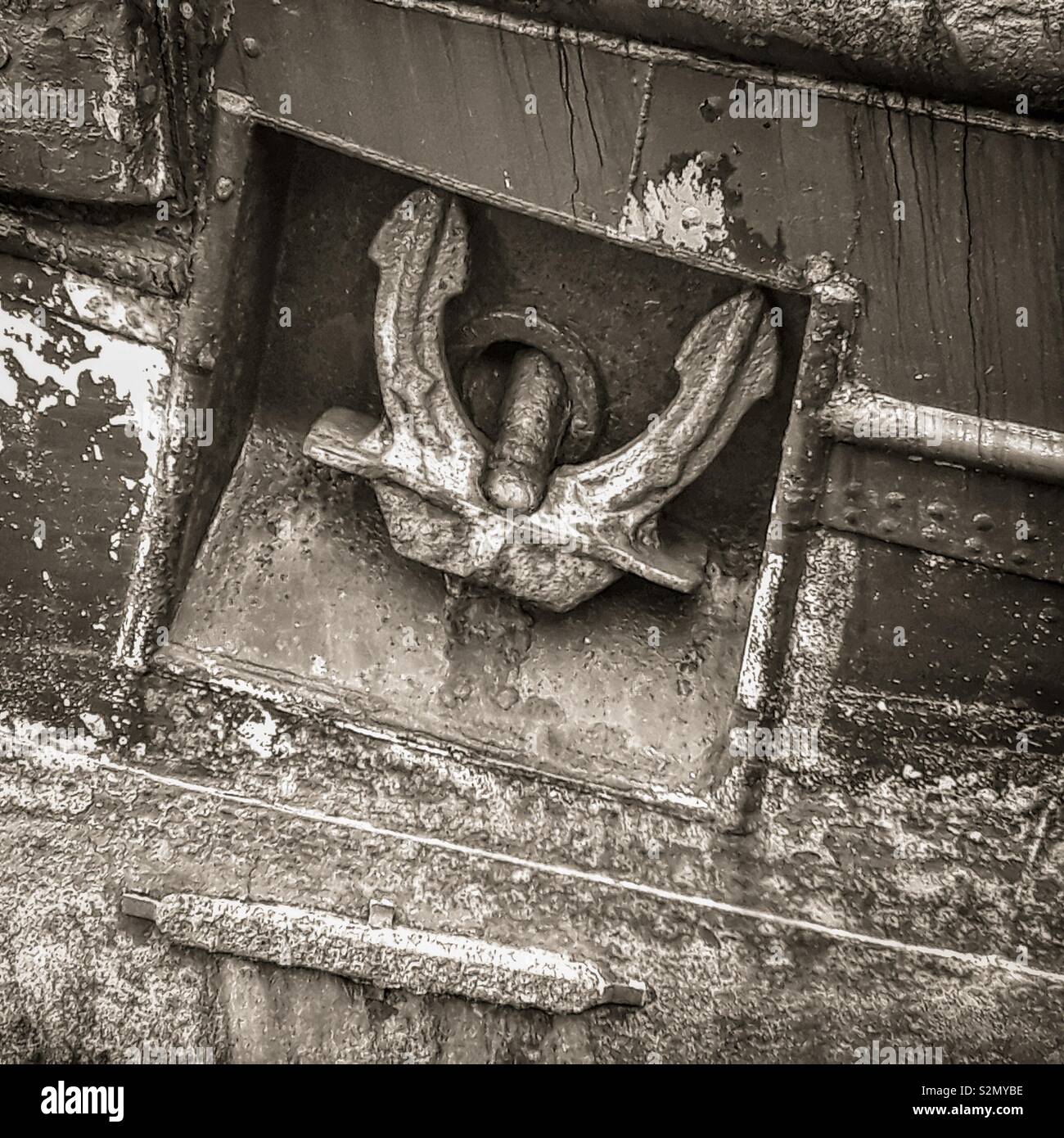 Old anchor in a rusty hull, Irvine, Ayrshire, Scotland, UK - Smartphone Captured Stock Image