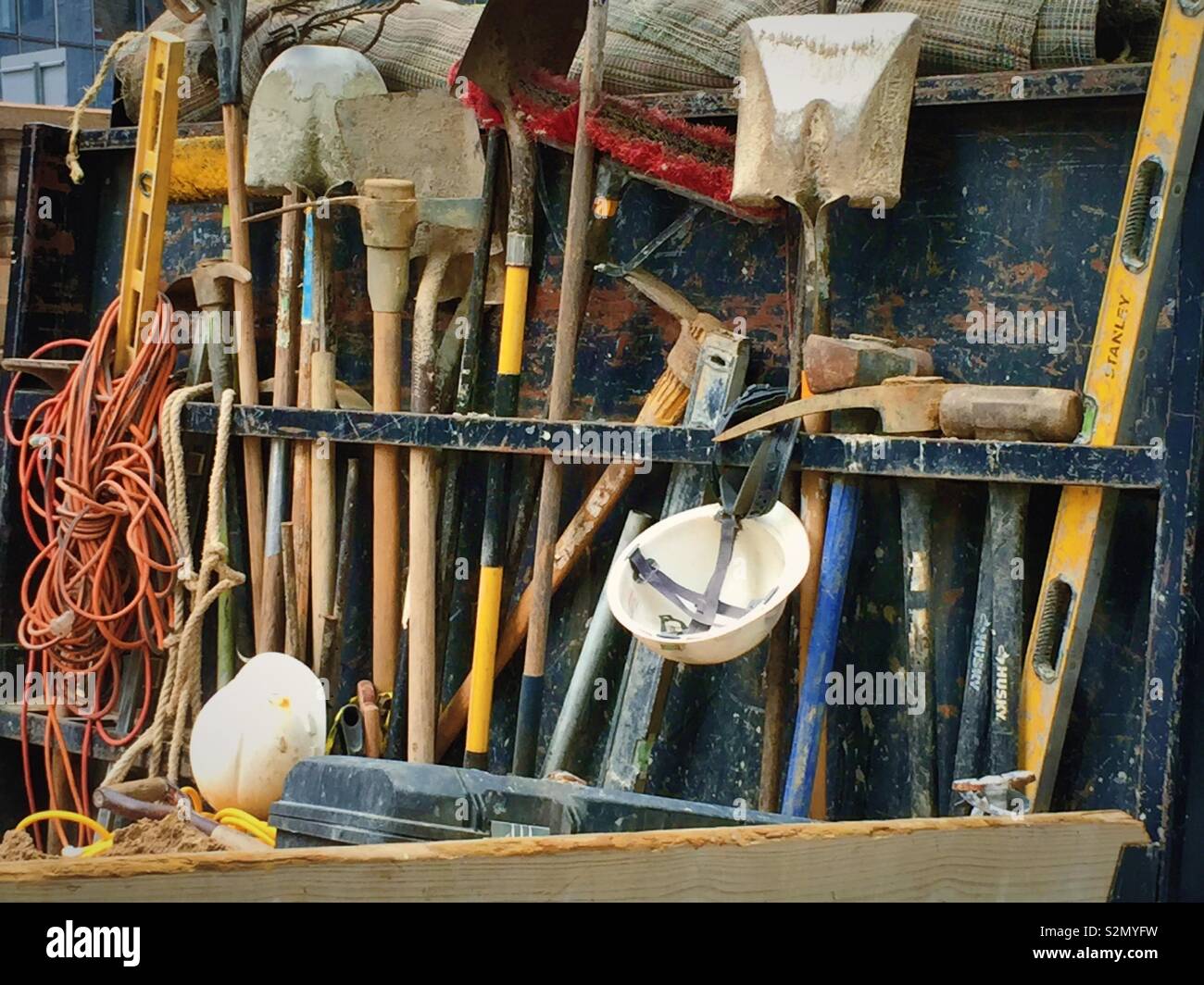 Tools and shovels in a rack on the back of a truck, USA - Smartphone Captured Stock Image