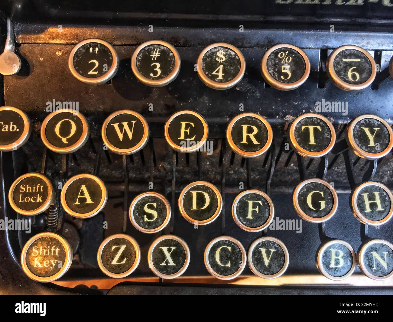 Full frame closeup of an antique typewriter keys spelling QWERTY. - Smartphone Captured Stock Image