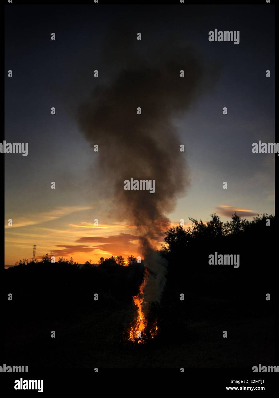 Early morning bonfire, Catalonia, Spain. - Smartphone Captured Stock Image