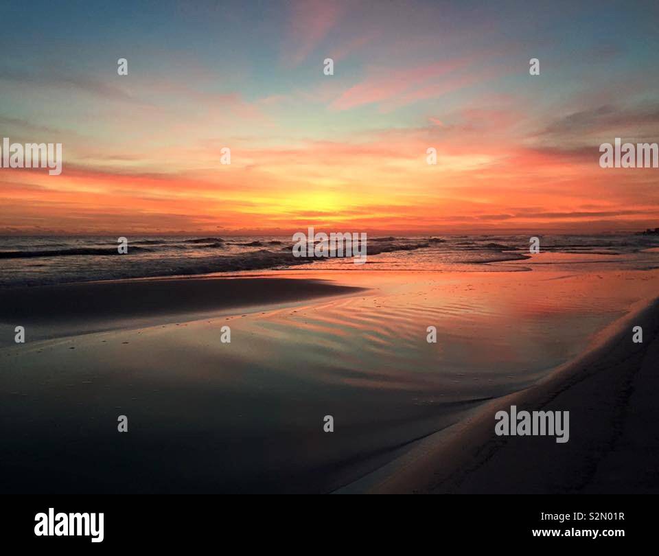 Florida beach sunset with color and textures in sand - Smartphone Captured Stock Image