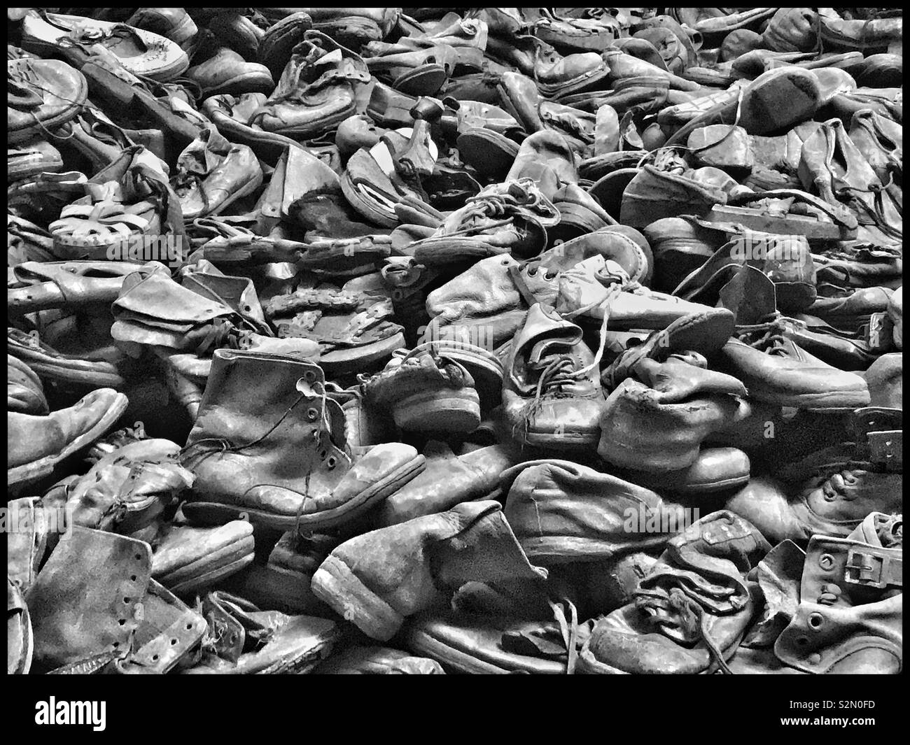 A small part of the piles of shoes and boots that were confiscated from the Jewish people who were sent to the Nazi Auschwitz Concentration Camp in Poland during WW2. Most were gassed or executed. © - Smartphone Captured Stock Image