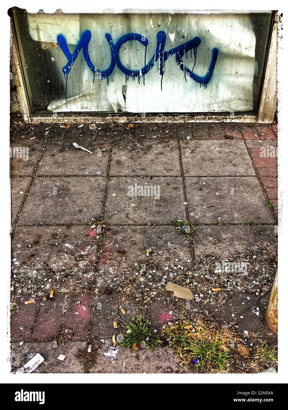 Urban squalor under graffiti tag of ‘Yuck’ - Smartphone Captured Stock Image