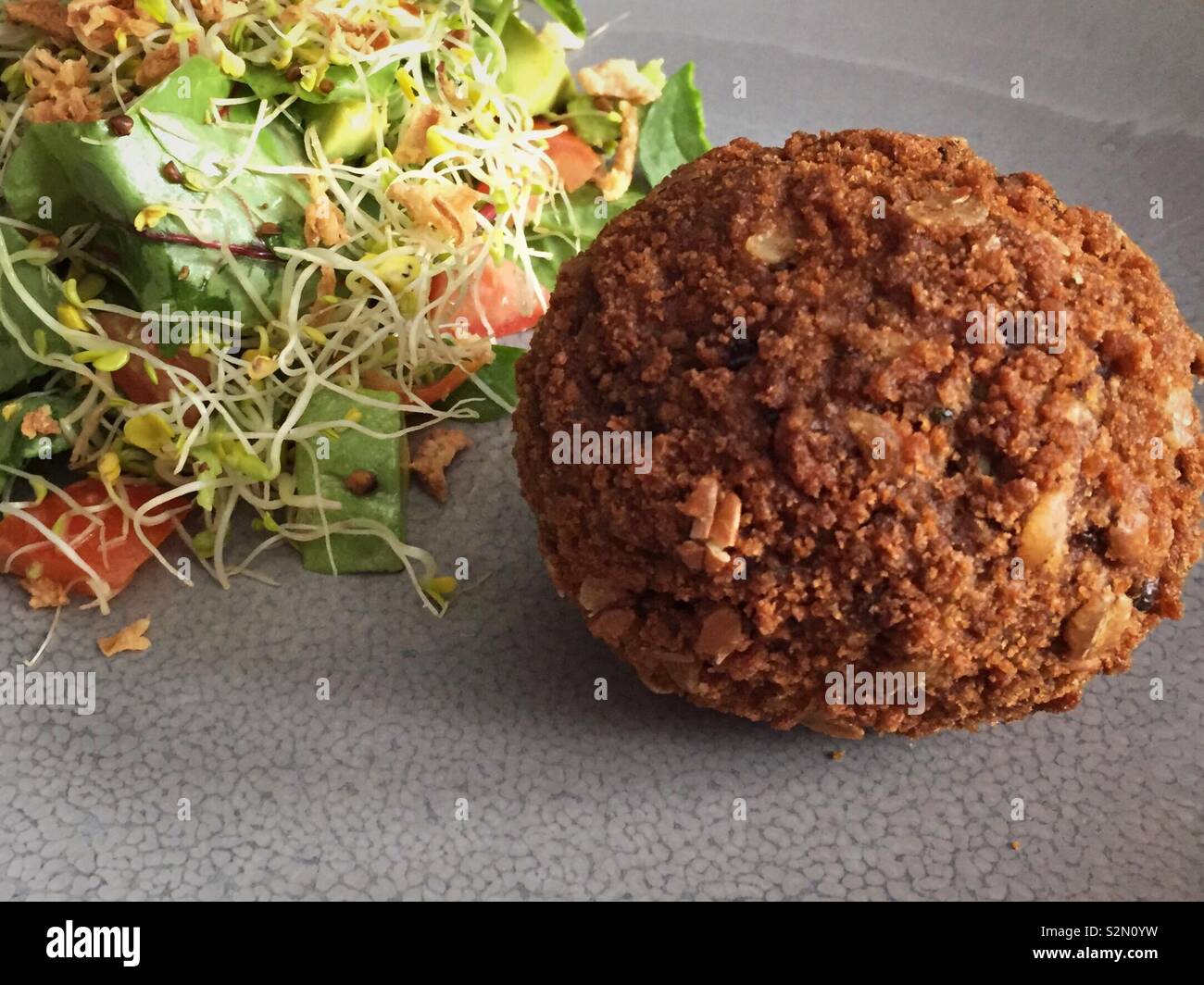 Posh giant scotch egg for lunch with salad - Smartphone Captured Stock Image