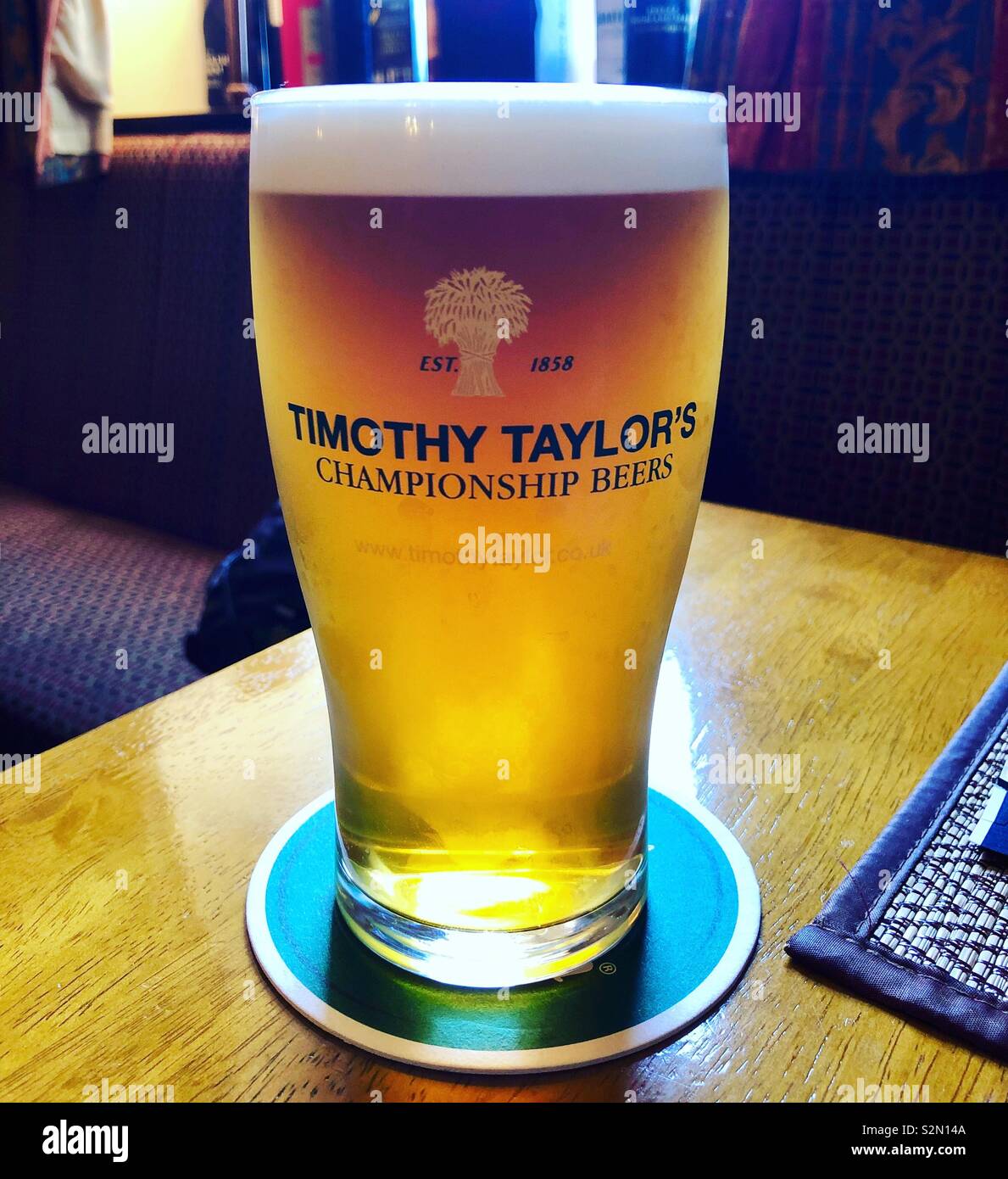 Pint of beer at the Pub after a long walk on a Sunday. Stock Photo