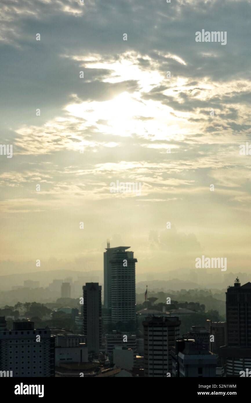 Skyscraper in Kuala Lumpur by sunset and dusty air. Stock Photo