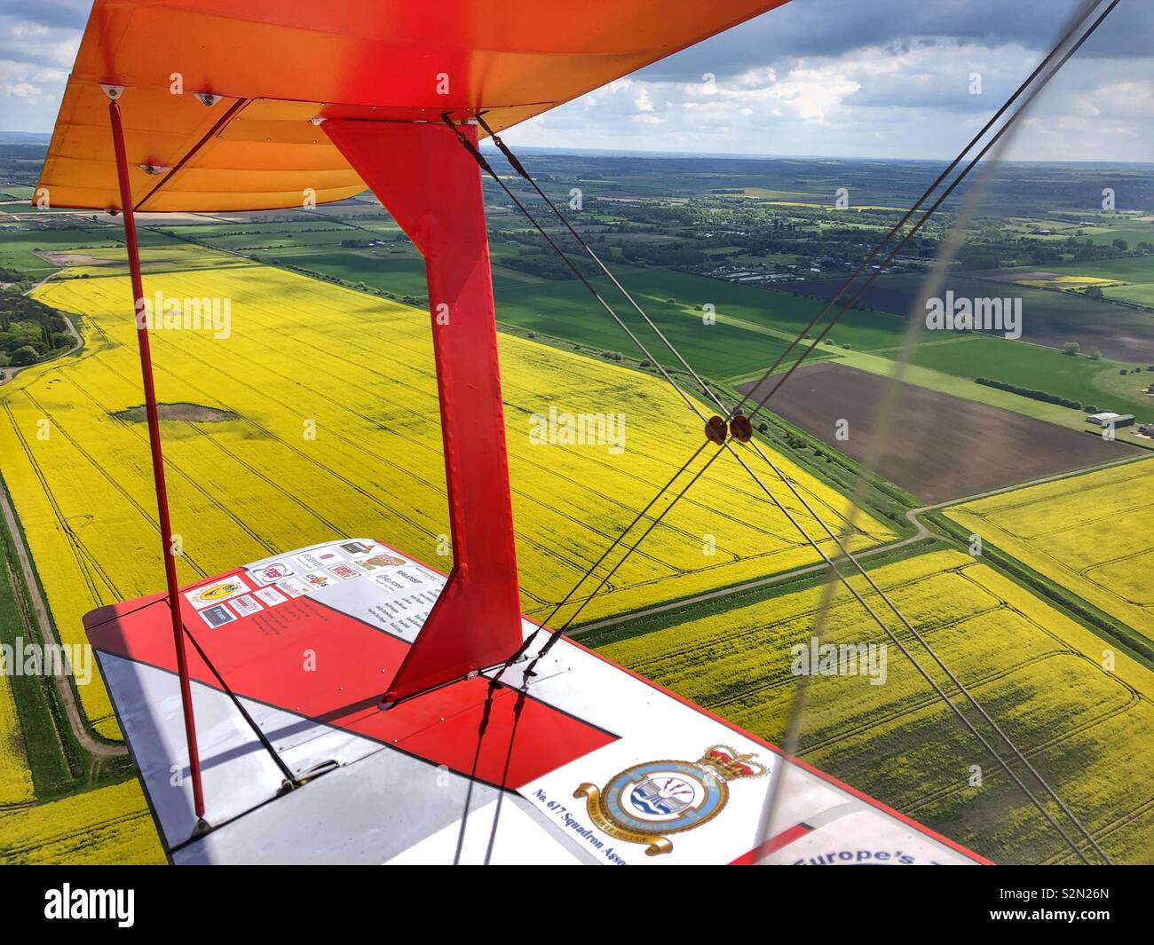 View of a grass airfield from an open cockpit Biplane Stock Photo