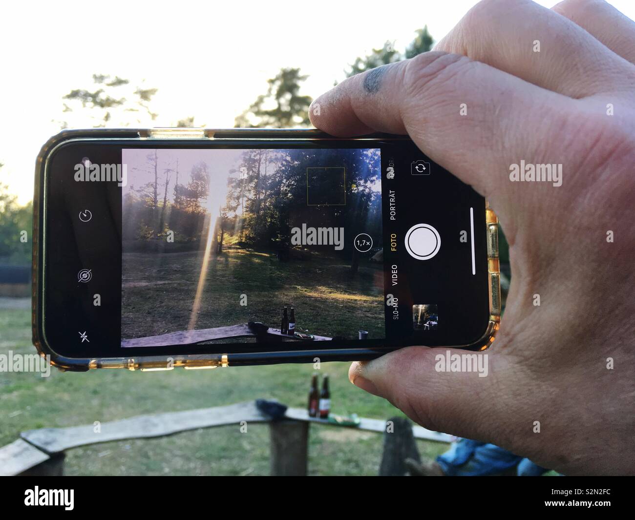 Hand Holding an iPhone While taking a photo - Smartphone Captured Stock Image